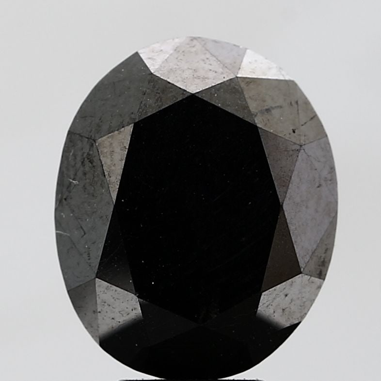 Oval 7.28ct Fancy Black VVS2 - Loose Natural Diamond: Oval 7.28ct Fancy Black VVS2 - Loose Natural Diamond Oval cut diamond with exceptional symmetry and polish, weighing 7.28 carats in Fancy Black color, VVS2 clarity, and EX condition. Its unique oval