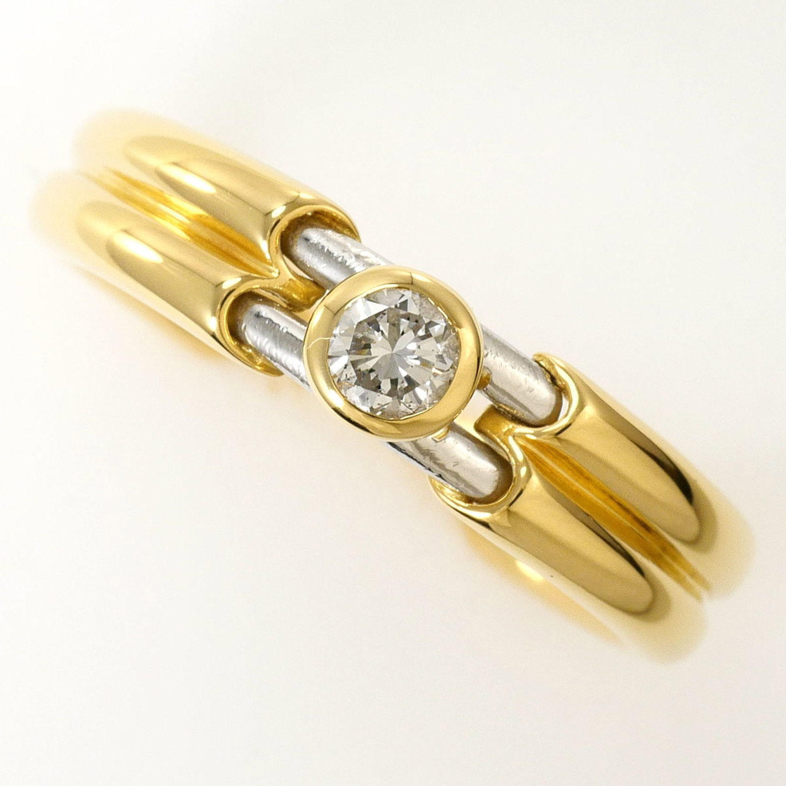 Unbranded Band Ring Platinum Yellow Gold (18K): Unbranded Band Ring Platinum Yellow Gold (18K) Unbranded platinum yellow gold band ring boasts an elegant design with a diamond accent, adding a touch of sophistication to any outfit. The 18K metal co