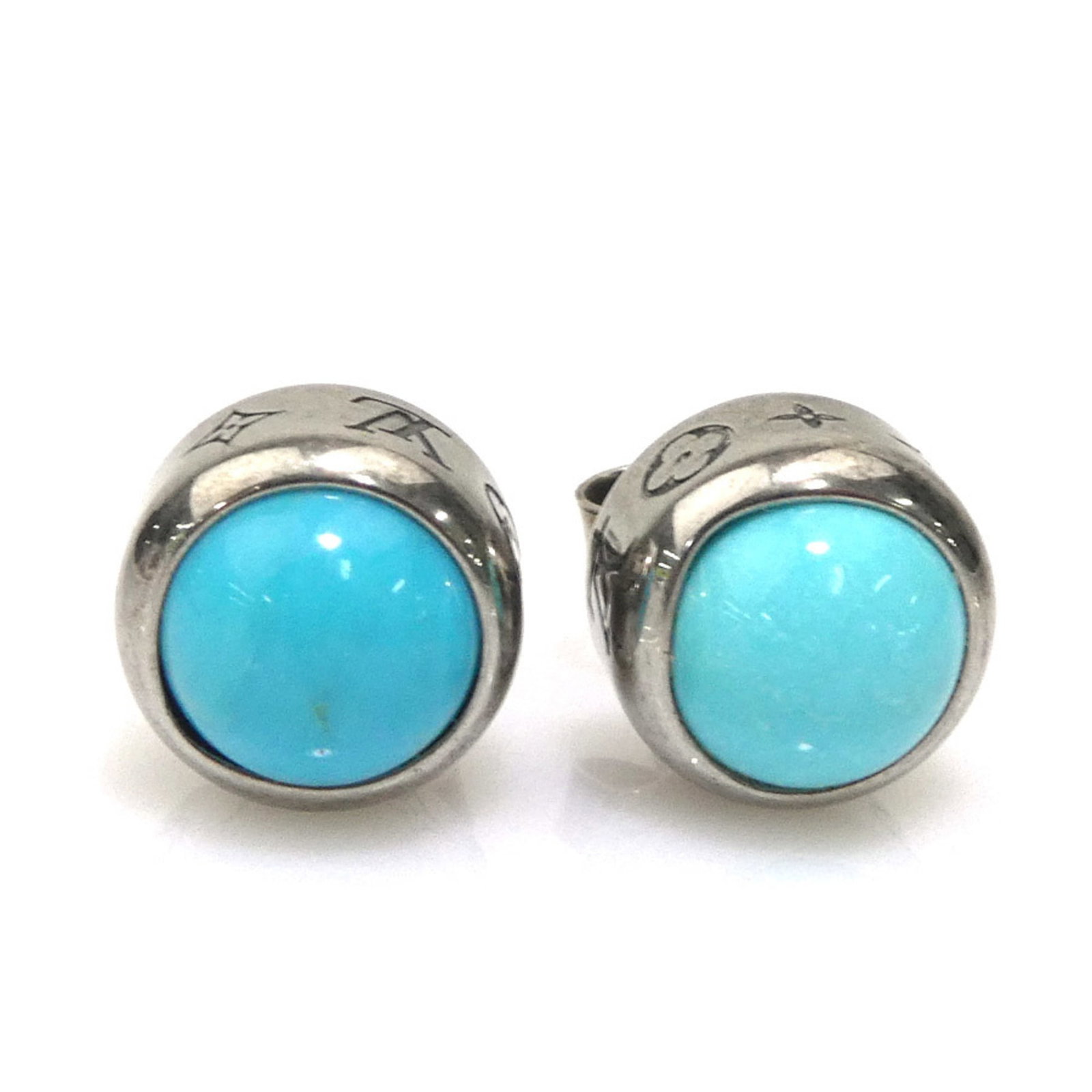 Metal Stud Earrings Louis Vuitton: Metal Stud Earrings Louis Vuitton Metal Stud Earrings Louis Vuitton bear the signature of the brand, featuring a sleek silver and turquoise design. Made from metal, these stud earrings showcase the