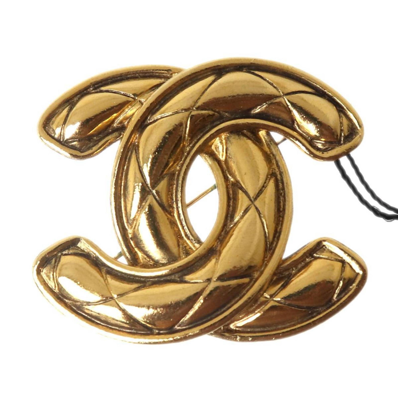 Chanel Brooch: Chanel Brooch Gold Chanel Brooch with a sleek design, measuring 4.9cm x 5.6cm in size. This elegant accessory bears a signature and features a classic style that complements any outfit. The brooch is 