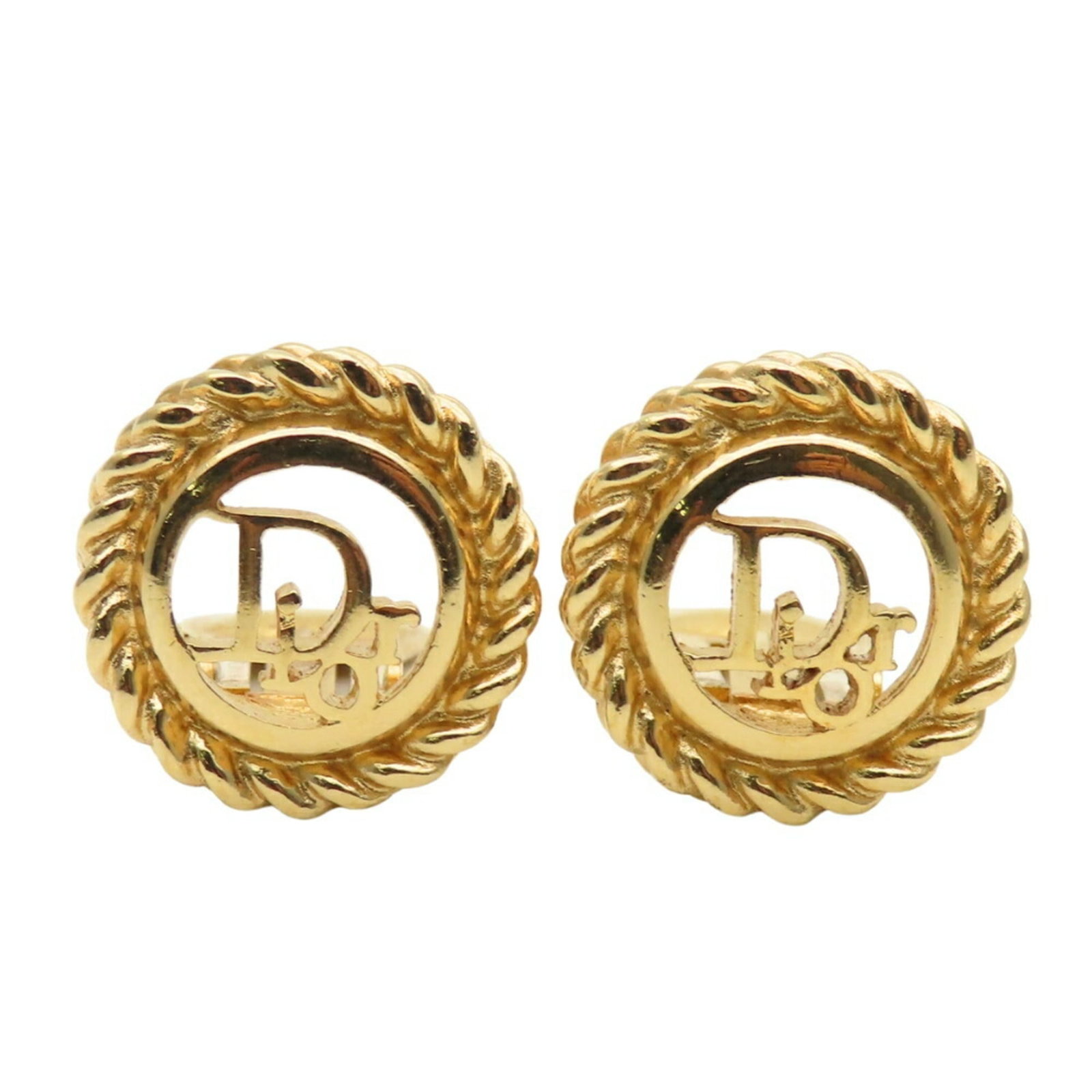 Metal clip earrings by Christian Dior: Metal clip earrings by Christian Dior Gold metal clip earrings by Christian Dior, measuring 18.50mm x 18.50mm in size and weighing 9.3g. These elegant earrings feature a sleek design that showcases th