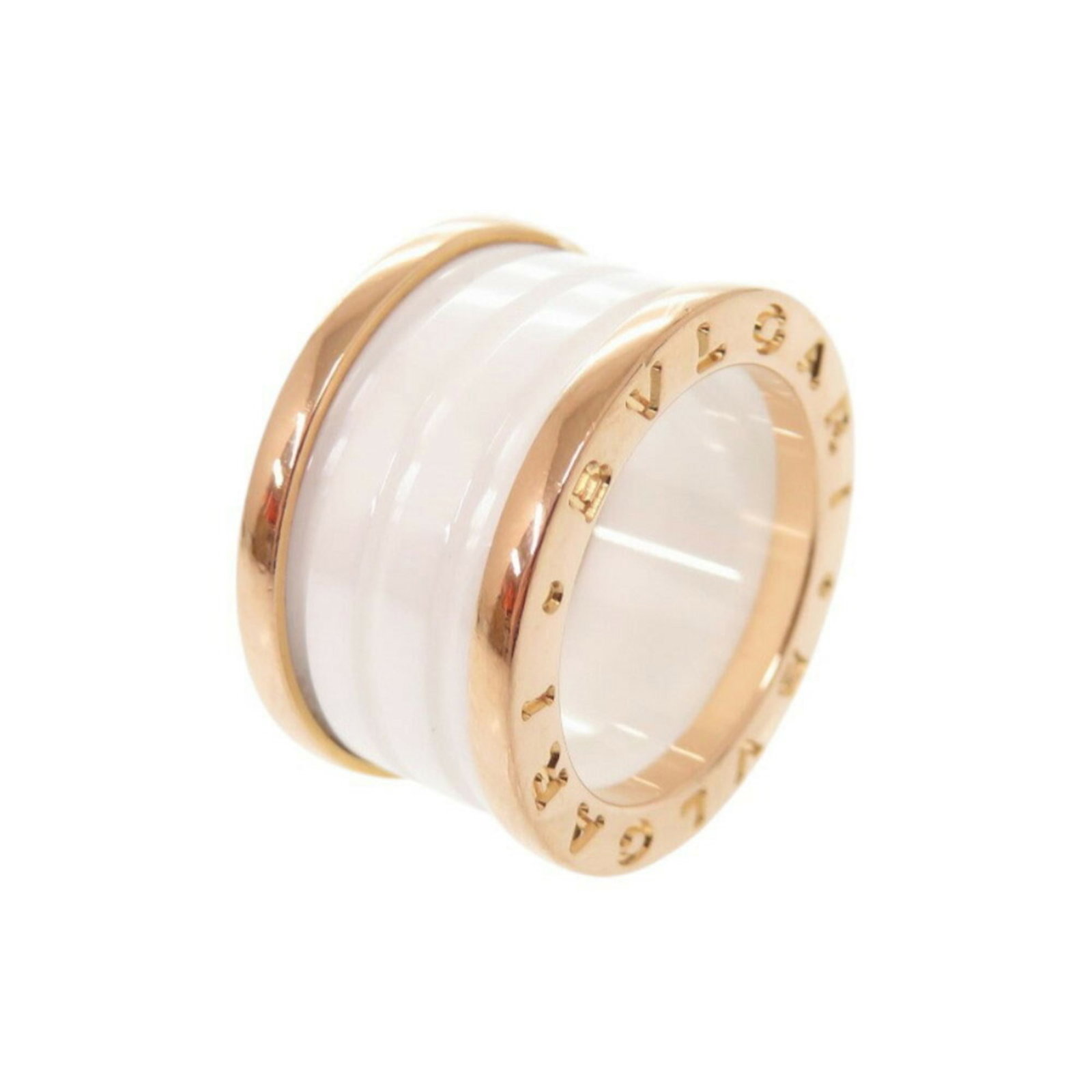 Bvlgari Band Ring Ceramic Pink Gold (18K): Bvlgari Band Ring Ceramic Pink Gold (18K) Bvlgari's iconic Band Ring Ceramic Pink Gold (18K) boasts a striking ceramic design in pink gold, making it a standout accessory for any occasion. This 18K pi
