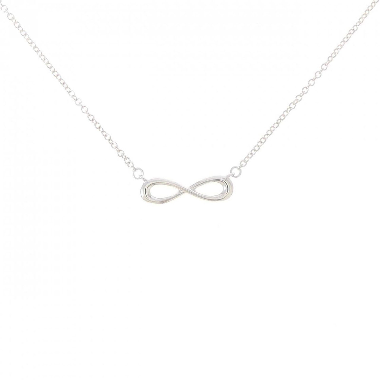 Infinity Necklace by Tiffany: Infinity Necklace by Tiffany Silver 925 Infinity Necklace by Tiffany, featuring a 4.2mm x 14.1mm pendant with a 41 cm - 46 cm adjustable neck circumference, bearing the Tiffany brand and MPN 60014279.