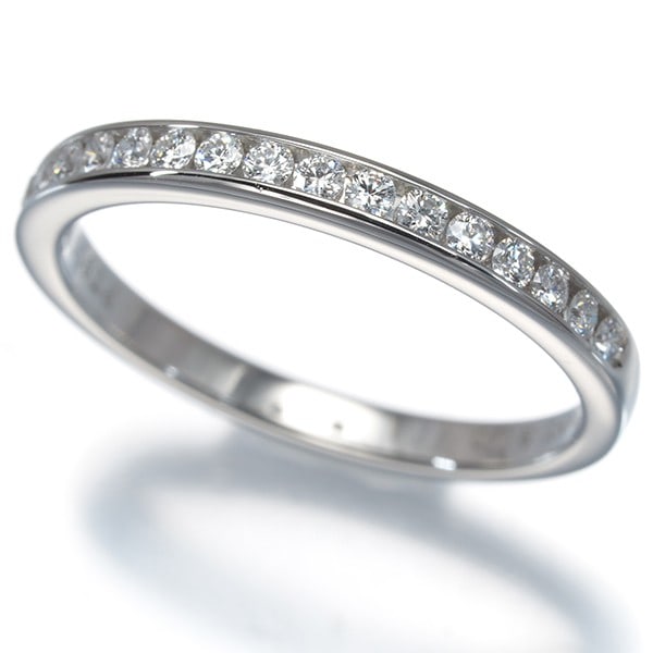 Diamond Ring Tiffany & Co. Wedding Band Channel Set Half Us5 Pt 950: Diamond Ring Tiffany & Co. Wedding Band Channel Set Half Us5 Pt 950 Tiffany & Co.'s platinum wedding band boasts an elegant channel set design, showcasing a natural diamond in a stunning setting. This