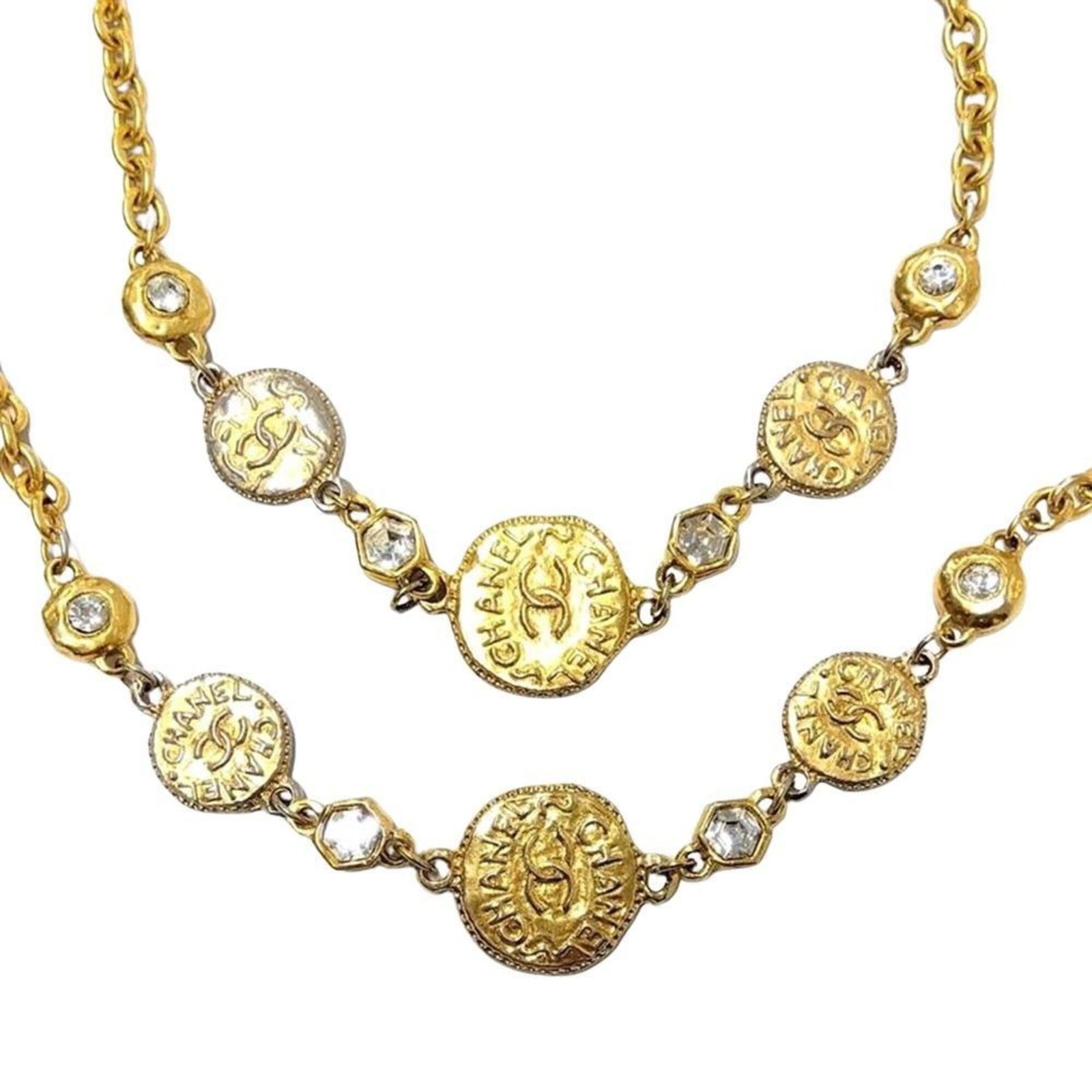 Rhinestone vintage gold coin necklace by Coco Chanel: Rhinestone vintage gold coin necklace by Coco Chanel Vintage gold coin necklace by Coco Chanel boasts a striking rhinestone design, adding a touch of glamour to any outfit. The 87cm long chain and 6mm