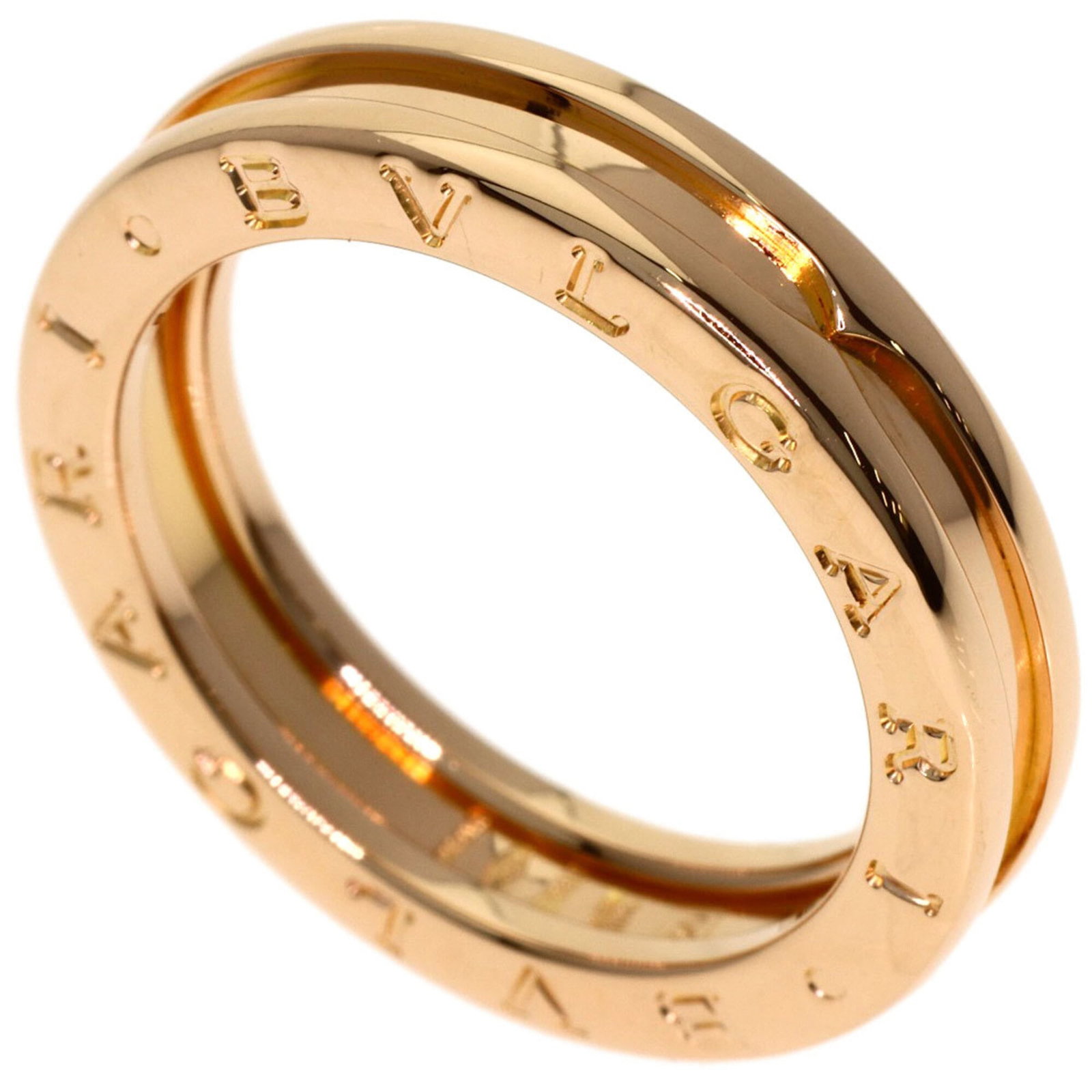 Pink gold band ring by Bvlgari 18k: Pink gold band ring by Bvlgari 18k Pink gold band ring by Bvlgari, featuring 18k pink gold material and a US size 7.5 fit. This elegant band showcases the luxury brand's signature style with its high-