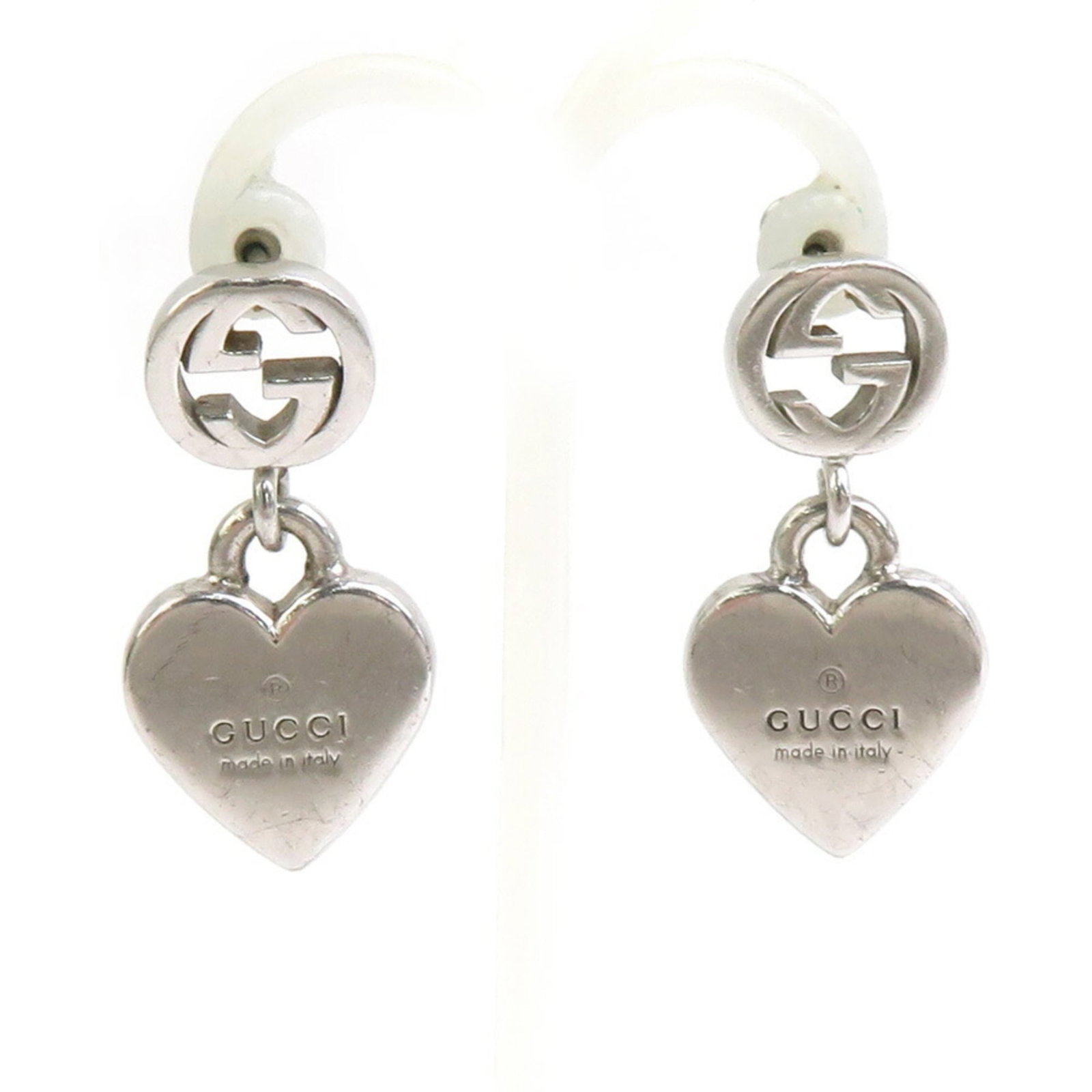 Silver 925 Gucci Stud Earrings: Silver 925 Gucci Stud Earrings Silver 925 Gucci Stud Earrings are made from high-quality silver material, featuring the iconic Gucci brand. These stud earrings measure 28.00mm in height and 13.00mm in