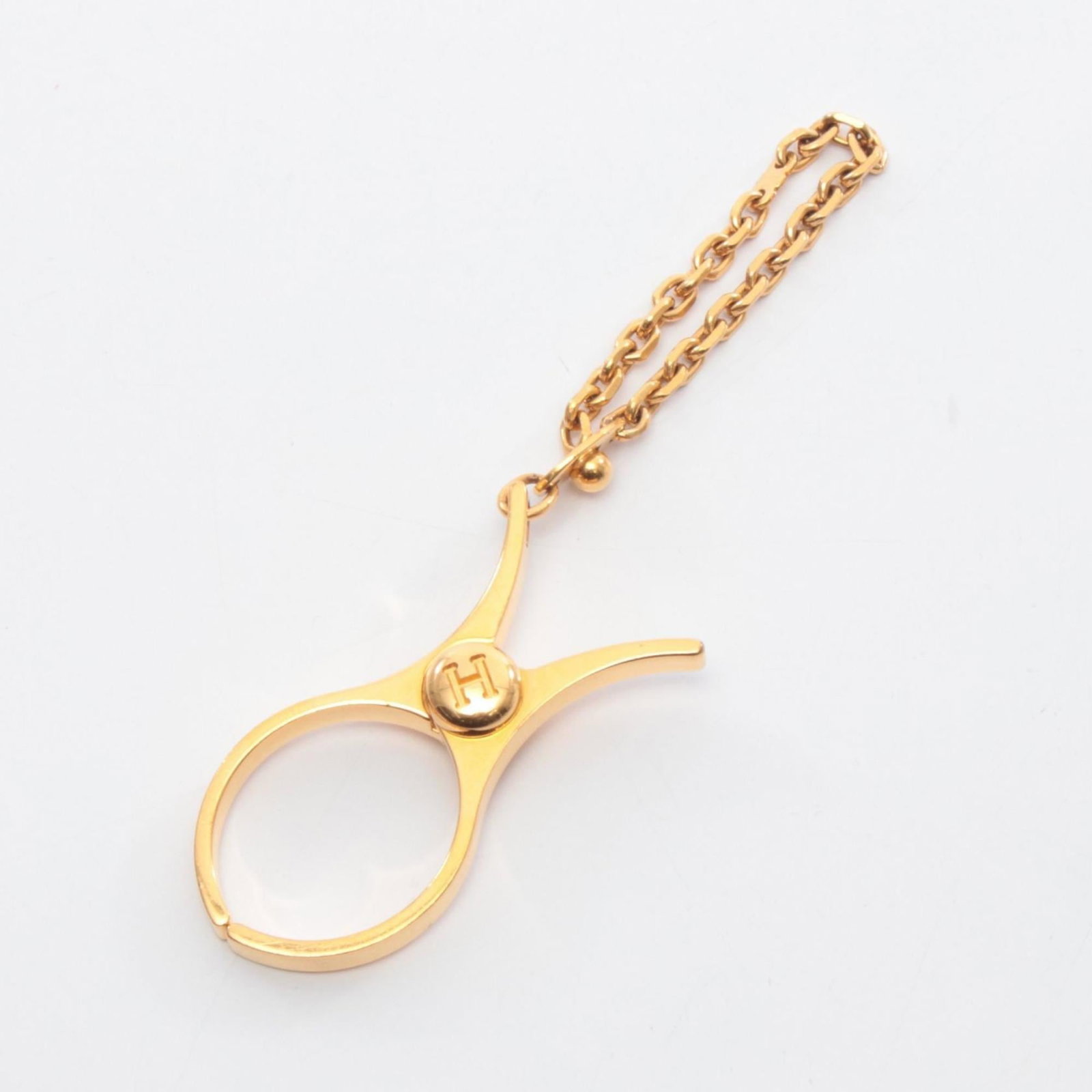Hermes Handbag Charm Gold Plating: Hermes Handbag Charm Gold Plating Gold plating on the Hermes handbag charm adds a touch of luxury to any accessory. This charm's gold finish gives it a sleek, sophisticated look that complements vario