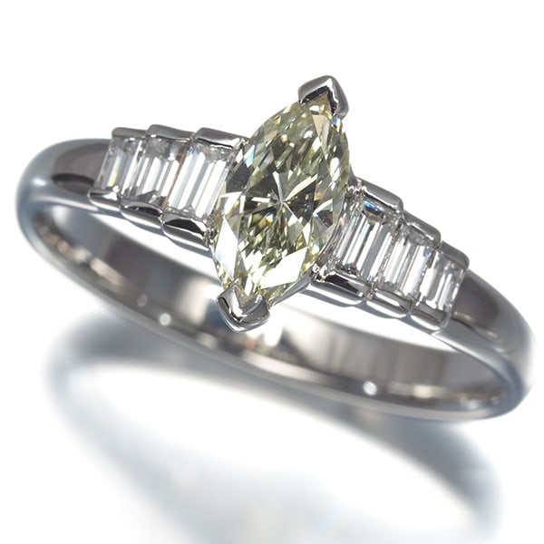 Yellow & Clear Diamond 0.73Ct/ 0.40Ct Marquise-Cut Baguette-Cut Ring Pt 900: Yellow & Clear Diamond 0.73Ct/ 0.40Ct Marquise-Cut Baguette-Cut Ring Pt 900 Platinum metal purity shines in this striking ring, featuring a 0.73ct yellow and clear diamond marquise-cut baguette-cut ce