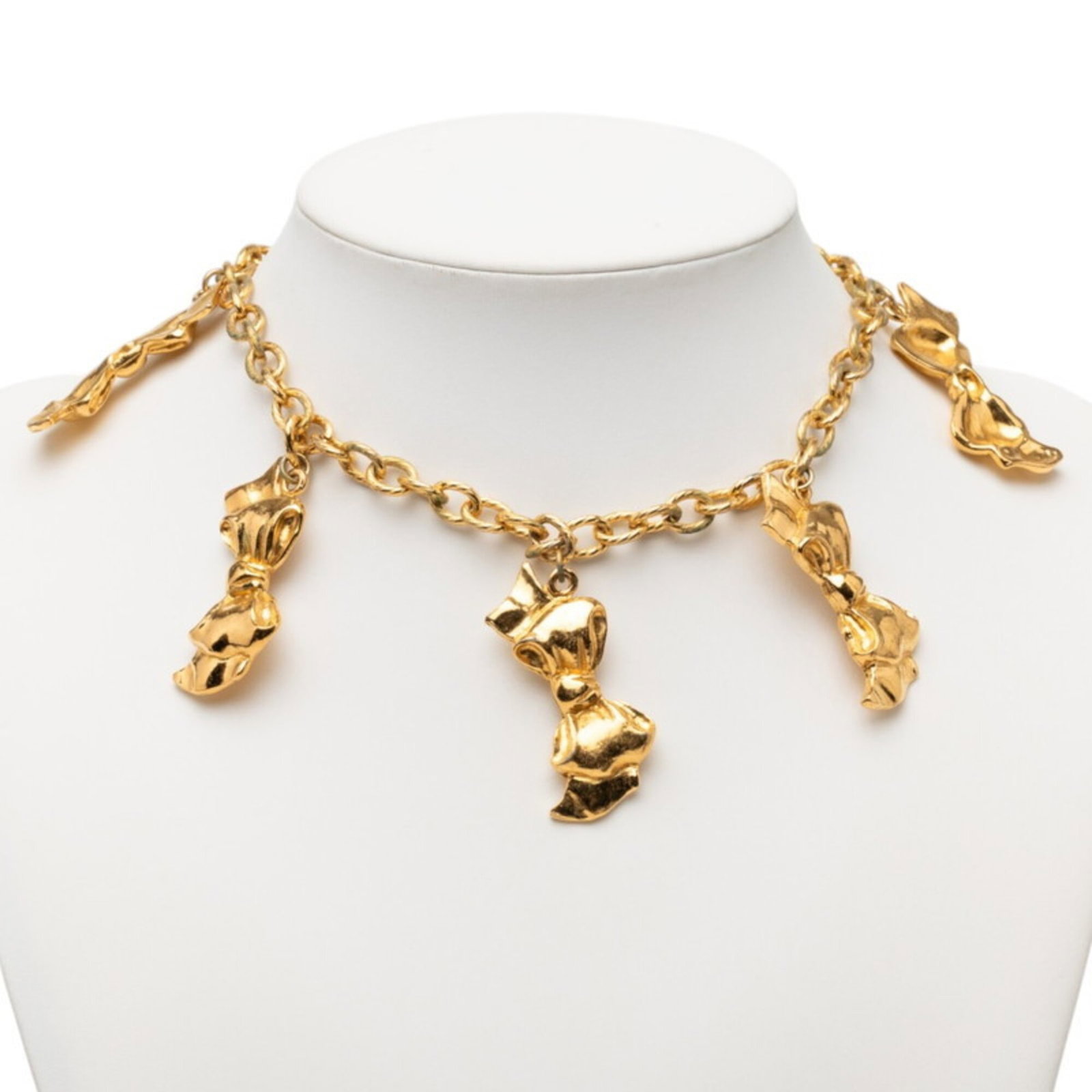 Women's Gold Plated Chain Necklace with Ribbon Pendant Chanel.: Women's Gold Plated Chain Necklace with Ribbon Pendant Chanel. Gold Plated Chain Necklace with Ribbon Pendant from Chanel. This elegant necklace features a gold plated chain and a ribbon pendant, meas