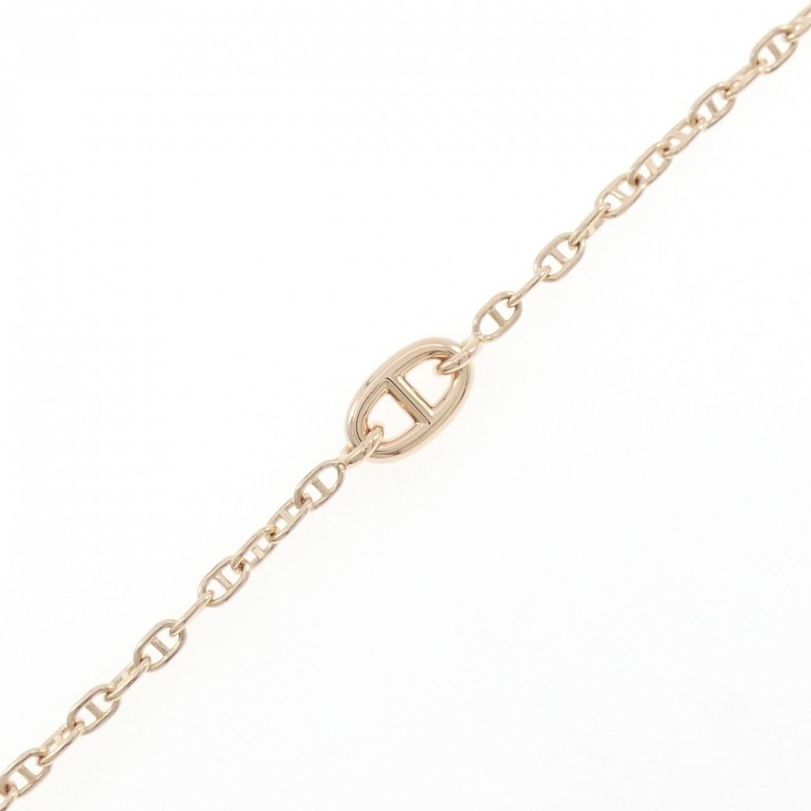 Pink Gold Charm 18k Hermes: Pink Gold Charm 18k Hermes Pink gold (18K) charm bracelet from Hermes, measuring 16.5cm in length, features a distinctive pink gold hue and a classic design that exudes elegance. The 18k gold material