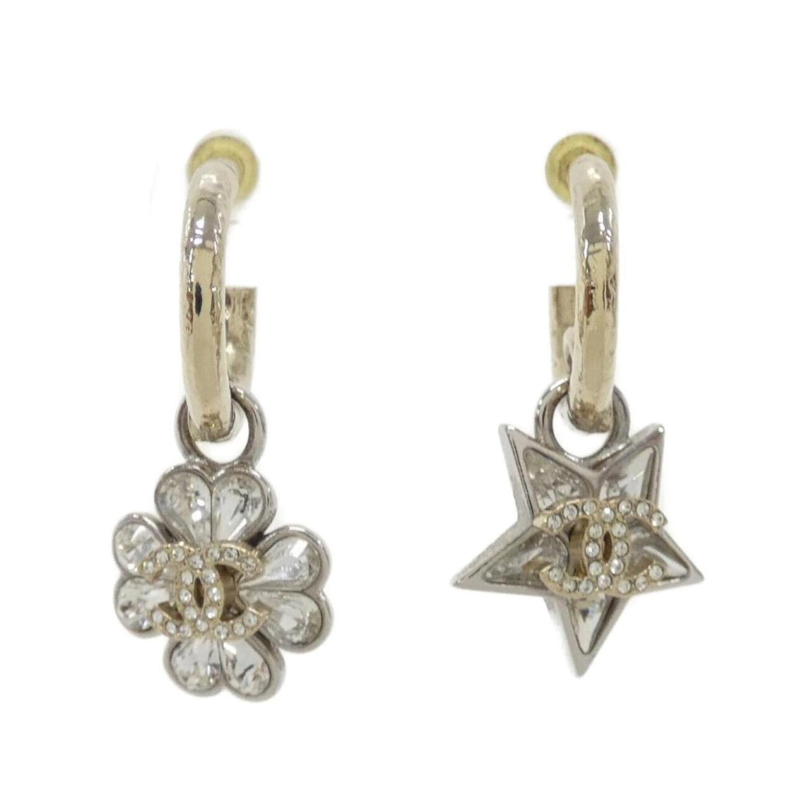 Chanel earrings: Chanel earrings Drop earrings in clear, gold, and silver from the iconic Chanel brand. Measuring 38mm x 17mm, these elegant earrings showcase a sleek design that complements any outfit. Made with a