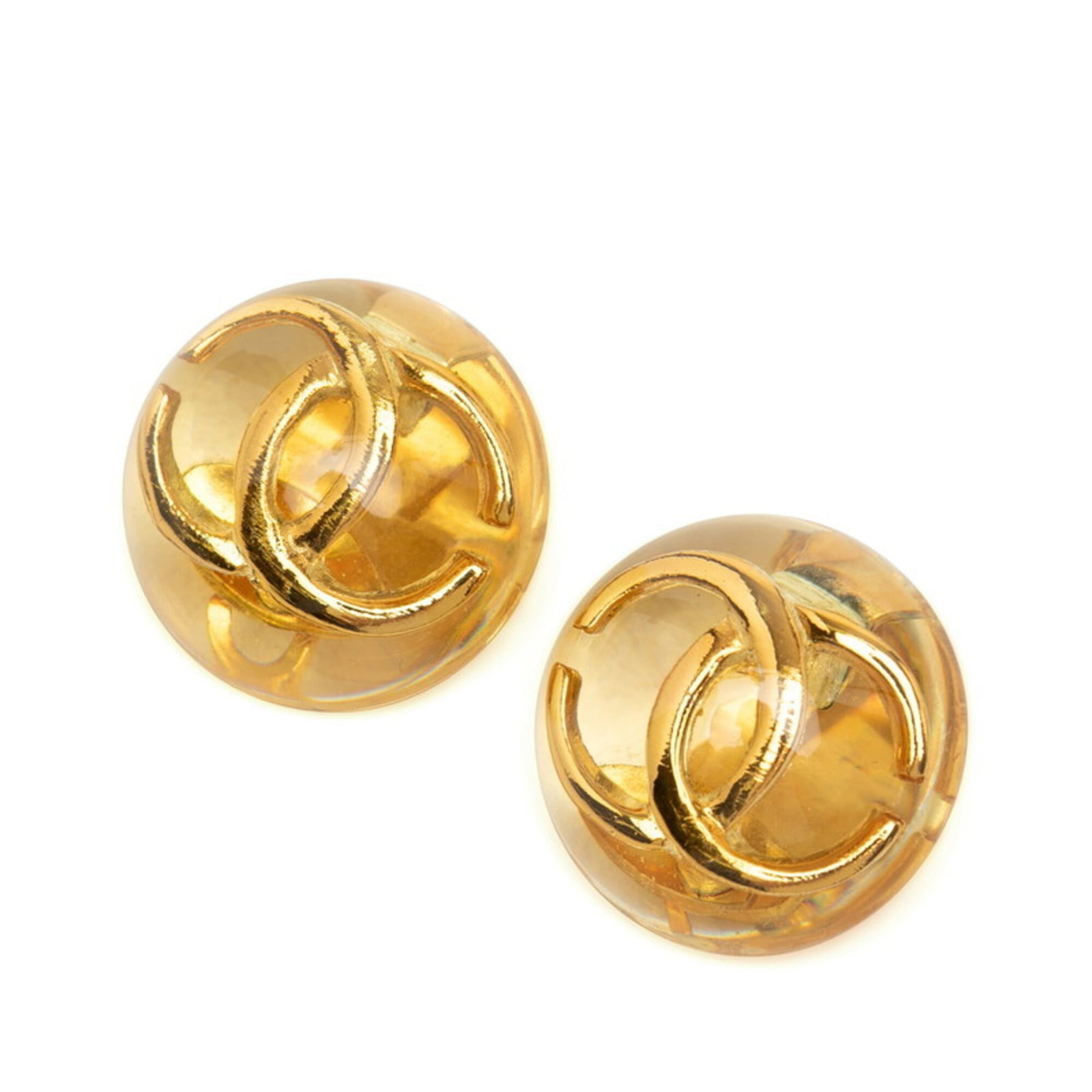 Resin Clip Chanel Earrings: Resin Clip Chanel Earrings Resin Clip Chanel Earrings in Clear and Gold. Made from high-quality resin, these clip earrings showcase a sleek design with a clear and gold finish. Measuring 30.50mm x 30.