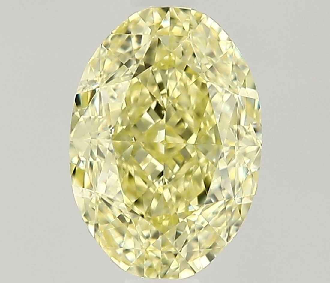 GIA Oval 0.73ct Fancy Yellow VVS2 - Loose Natural Diamond: GIA Oval 0.73ct Fancy Yellow VVS2 - Loose Natural Diamond GIA Oval 0.73ct Fancy Yellow VVS2 - Loose Natural Diamond.This loose natural diamond boasts an impressive oval cut, measuring 6.53L x 4.55W x 