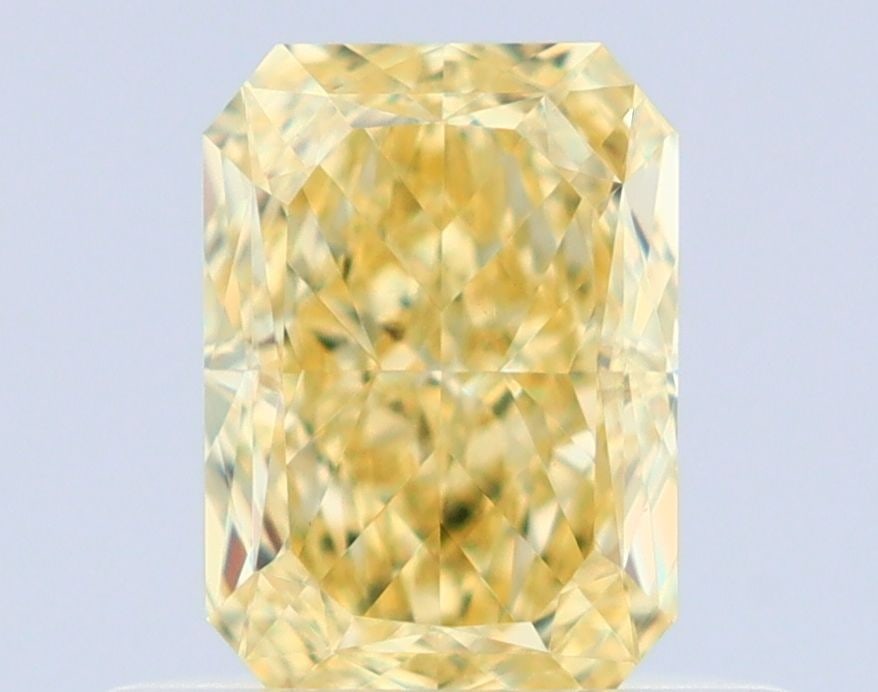GIA Radiant 0.55ct Fancy Yellow VVS2 - Loose Natural Diamond: GIA Radiant 0.55ct Fancy Yellow VVS2 - Loose Natural Diamond GIA certification ensures the diamond's authenticity and quality. This loose natural Fancy Yellow VVS2 diamond boasts exceptional clarity,