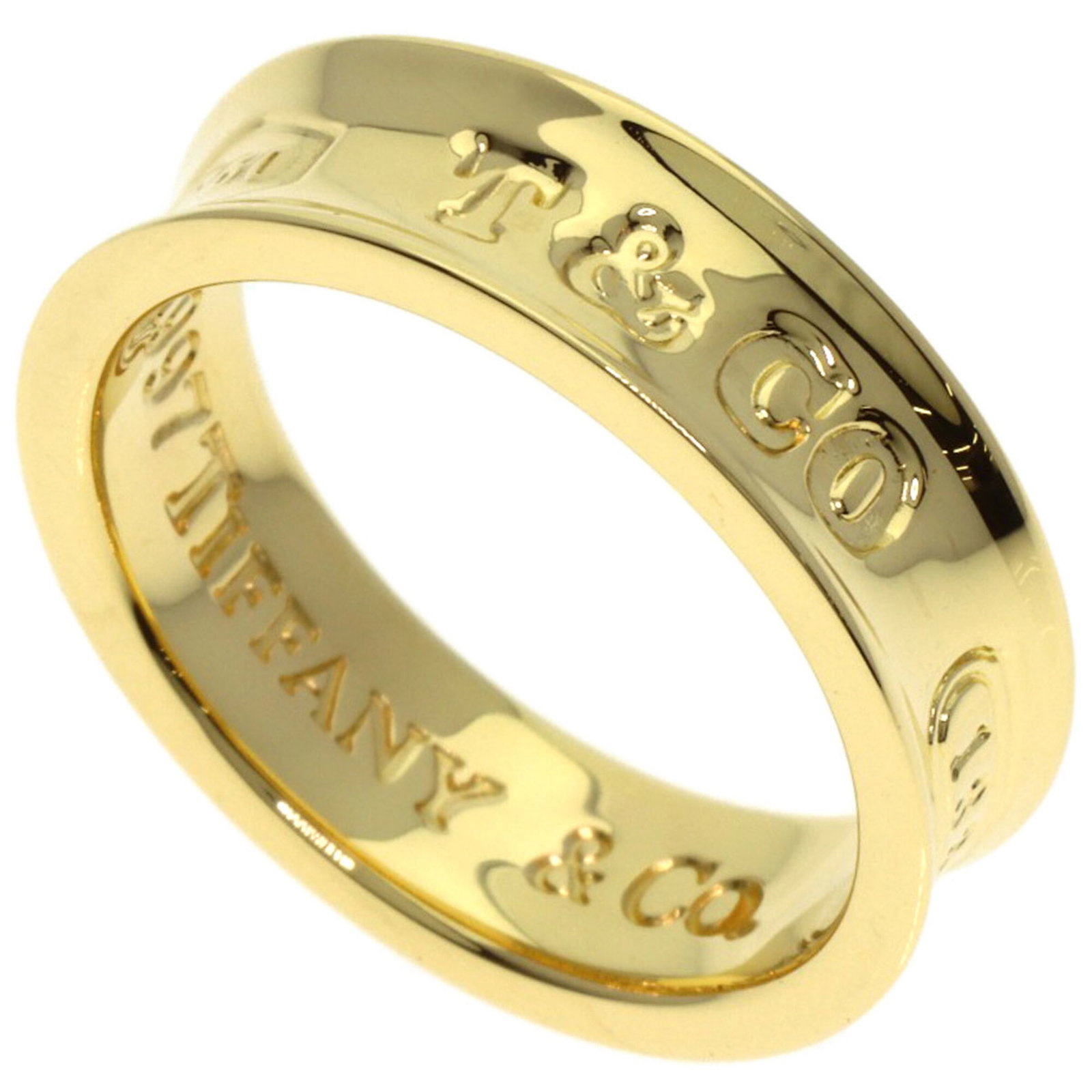 Ring Tiffany Band: Ring Tiffany Band 18K yellow gold band ring with a classic Tiffany design, featuring a sturdy 6.5 US size and 5.6mm width that adds a touch of elegance to any outfit. Weighing in at 6.4g, this beautif