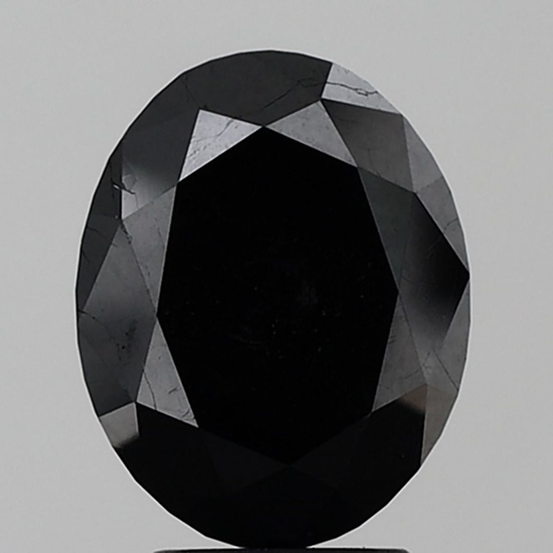 Oval 4.13ct Black VVS2 - Loose Natural Diamond: Oval 4.13ct Black VVS2 - Loose Natural Diamond Oval cut diamond with exceptional clarity and polish, boasting a vibrant black color. Measuring 4.13 carats, it presents itself as a rare natural gemston