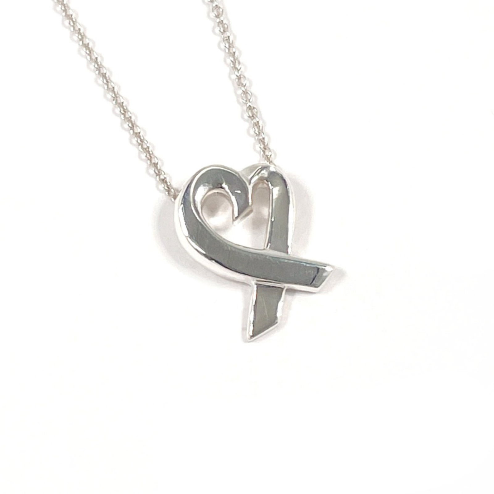 Tiffany & Co. Tiffany Loving Heart Paloma Picasso Necklace In 925 Sterling Silver For Women: Tiffany & Co. Tiffany Loving Heart Paloma Picasso Necklace In 925 Sterling Silver For Women Tiffany & Co.'s iconic Loving Heart Paloma Picasso Necklace shines in sterling silver, featuring the artist'