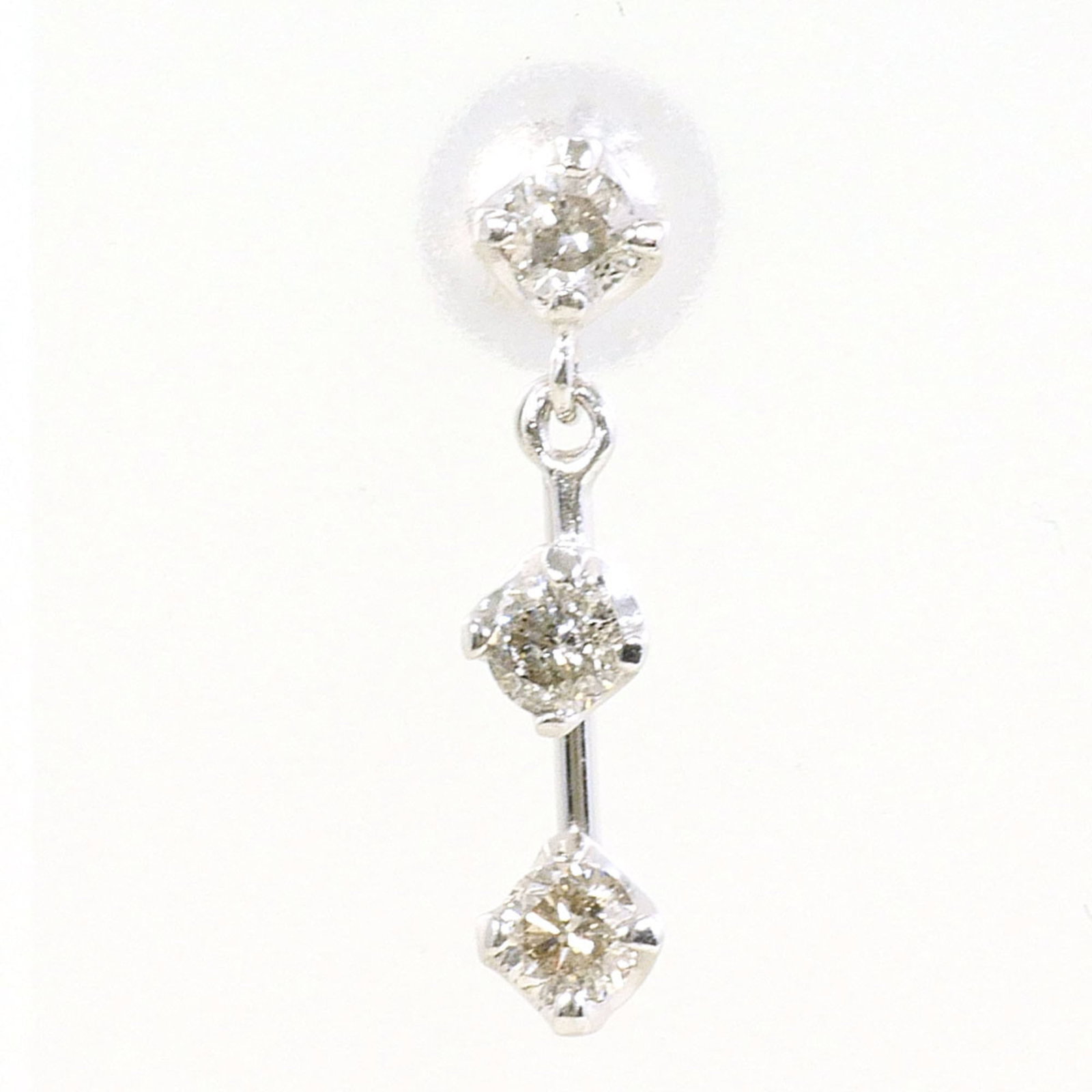 White Gold 14K Unbranded Earrings Drop: White Gold 14K Unbranded Earrings Drop White gold (14K) earrings drop with a diamond stone weighing 0.15 ct and a total weight of 0.2g/oz, crafted from high-quality white gold metal. The simplicity of