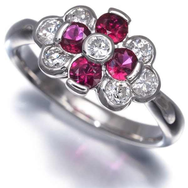 Ruby 0.51Ct Diamond 0.44Ct Flower Ring 900 Platinum: Ruby 0.51Ct Diamond 0.44Ct Flower Ring 900 Platinum 900 Platinum Ruby Flower Ring features two precious stones, a 0.51ct ruby and a 0.44ct diamond, set in a delicate flower design. The platinum metal 