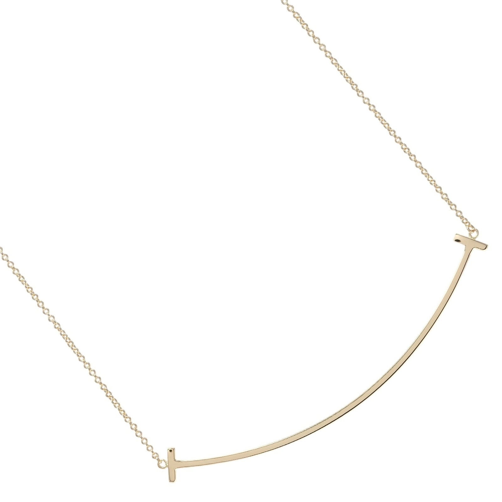 Tiffany & Co. T Smile Large Necklace 18K Pink Gold Approx. 3.75G.: Tiffany & Co. T Smile Large Necklace 18K Pink Gold Approx. 3.75G. Tiffany & Co. T Smile Large Necklace in 18K Pink Gold boasts a striking design with a pendant size of 68.7mm x 12mm, set against a pin