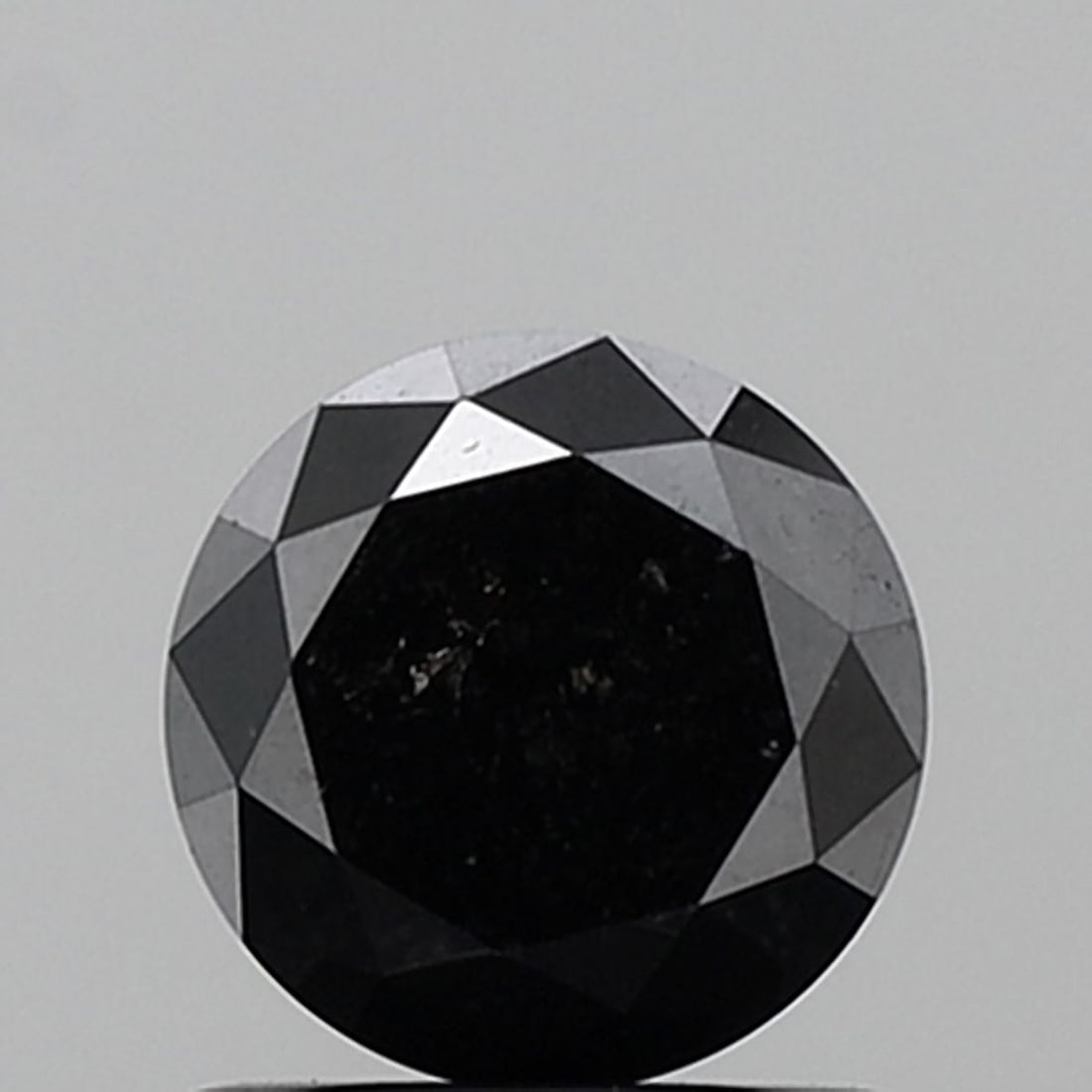 Round 1.26ct Fancy Black VVS2 - Loose Natural Diamond: Round 1.26ct Fancy Black VVS2 - Loose Natural Diamond Round 1.26ct Fancy Black VVS2 - Loose Natural Diamond, showcasing exceptional clarity and a deep, mysterious color, set in an EX cut that highligh