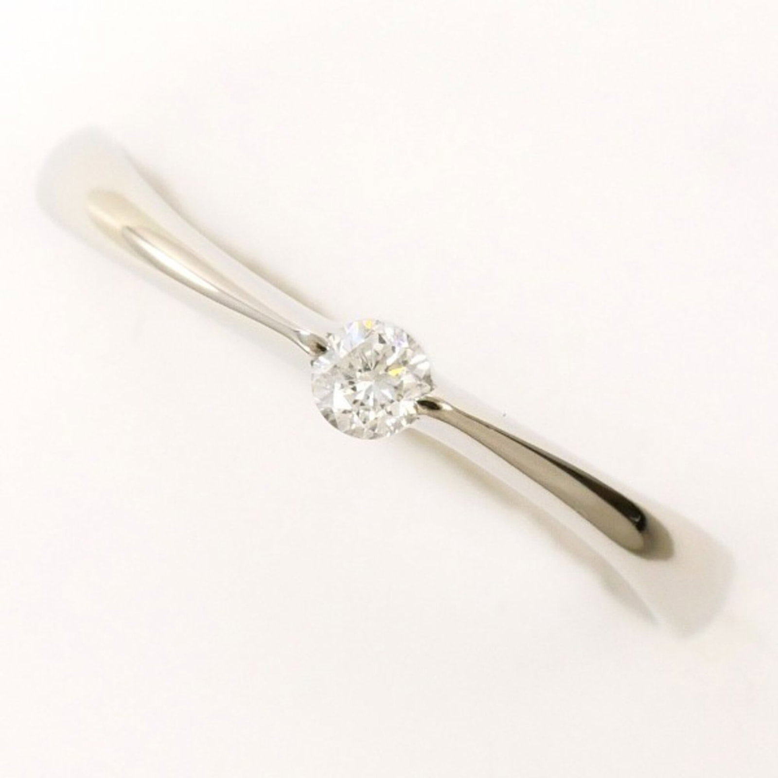 Band ring platinum unbranded: Band ring platinum unbranded Platinum band ring features a diamond stone weighing 0.08 carats, set in a platinum metal construction with a US size 6.5 and width of 3mm. This unbranded platinum band is
