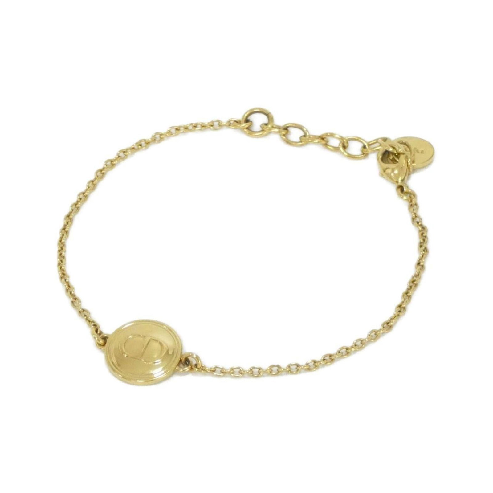 Christian Dior Charm Bracelet: Christian Dior Charm Bracelet Christian Dior Charm Bracelet in Gold, featuring a classic design with adjustable length to fit comfortably. The gold charm bracelet measures between 15.5cm and 18.5cm in