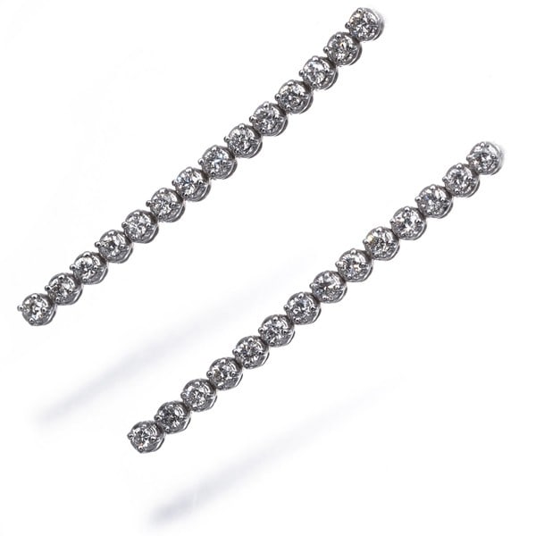 Diamond earrings 18k white gold 0.17ct/ 0.17ct drop: Diamond earrings 18k white gold 0.17ct/ 0.17ct drop 18k white gold diamond earrings feature two natural diamonds, totaling 0.17ct each, suspended from delicate drop designs. The 18k metal purity adds 