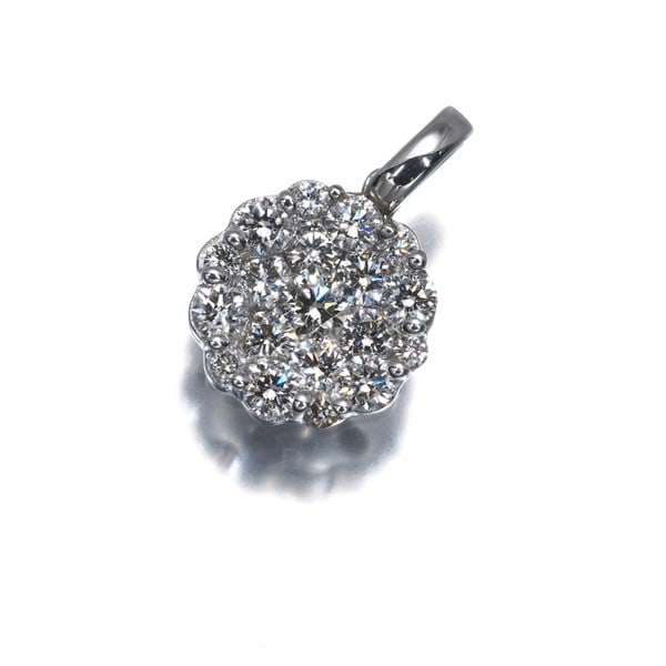 Paved Pendant in White Gold with 0.67Ct Diamond: Paved Pendant in White Gold with 0.67Ct Diamond Paved with intricate details, this 18k white gold pendant showcases a stunning 0.67ct diamond at its center. The delicate design and high-quality metal 