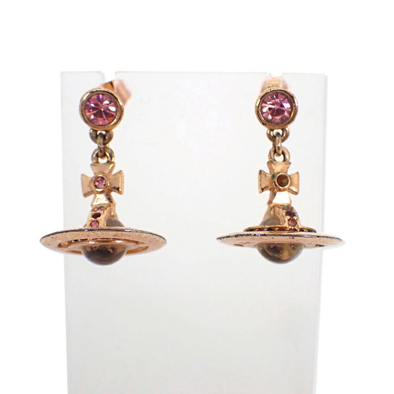 Stud earrings by Vivienne Westwood: Stud earrings by Vivienne Westwood Stud earrings by Vivienne Westwood, crafted in pink gold with a vibrant color stone. The earrings measure 15.50mm x 16.20mm and have a sleek, modern design. Bearer