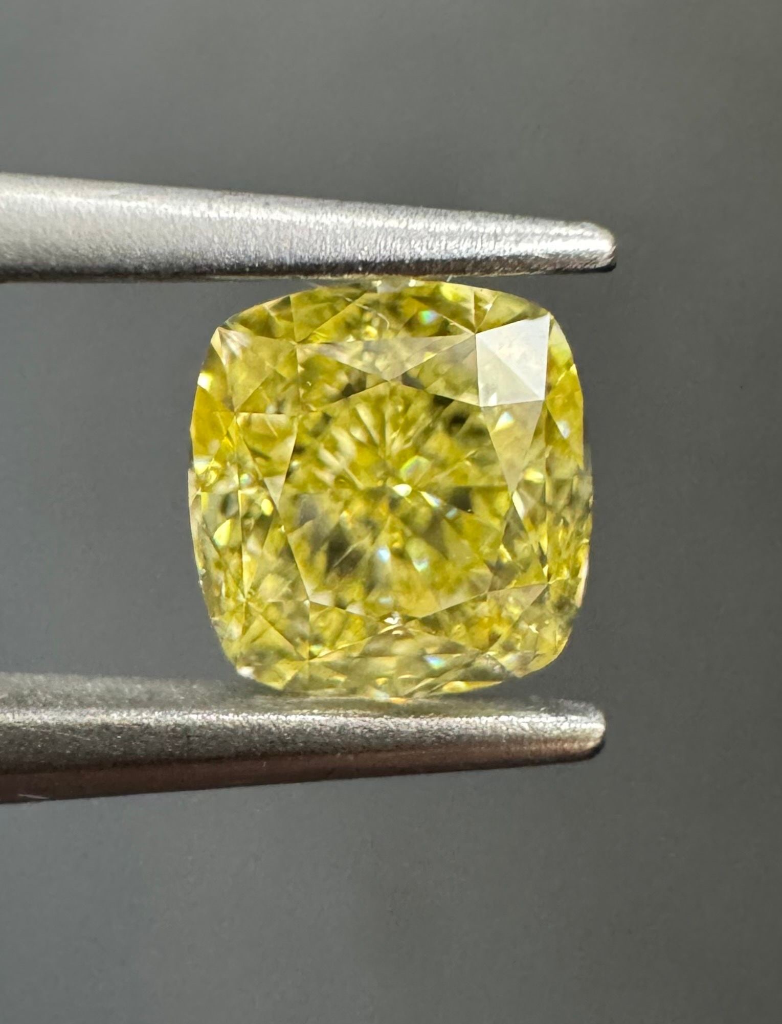 GIA Cushion Modified 0.72ct Fancy Intense Yellow VVS1 - Loose Natural Diamond: GIA Cushion Modified 0.72ct Fancy Intense Yellow VVS1 - Loose Natural Diamond 0.72ct Fancy Intense Yellow VVS1 - Loose Natural Diamond, certified by the Gemological Institute of America (GIA), boasts 