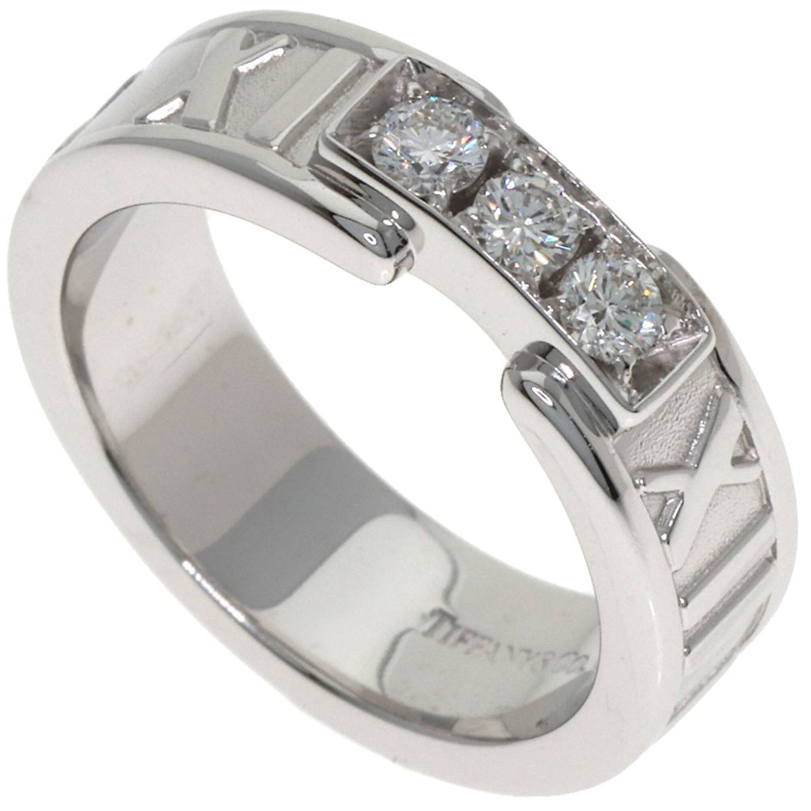 White Gold Tiffany Band Ring 18K: White Gold Tiffany Band Ring 18K 18K White Gold Tiffany Band Ring with Diamond Stone. This elegant band ring features 18K white gold and a diamond stone, showcasing the classic style of Tiffany & Co. 