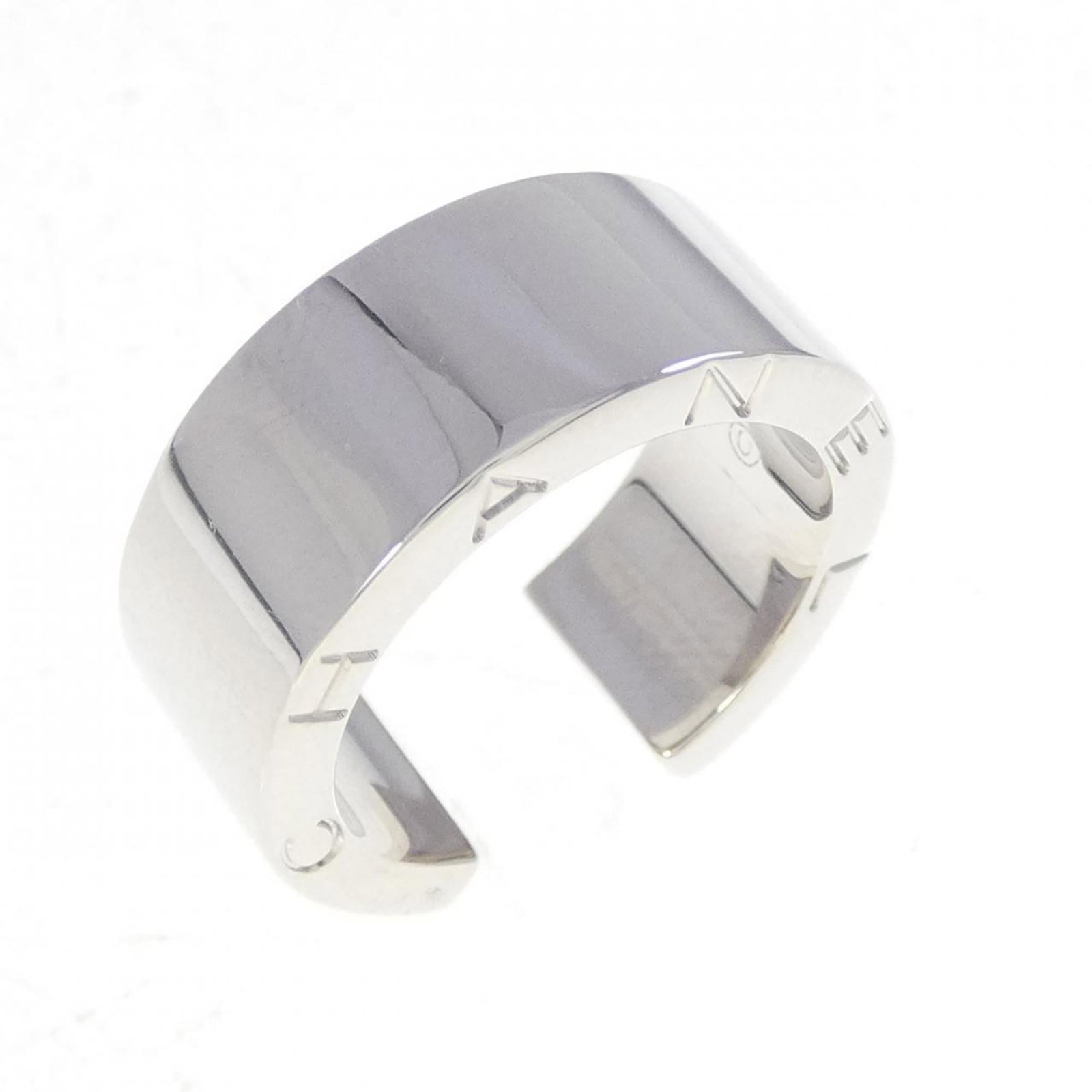 White Gold Chanel Ring 18K: White Gold Chanel Ring 18K White gold band ring from Chanel, crafted in 18K white gold. This elegant ring features a classic design and is available in US size 4.5. A timeless piece for those who appr
