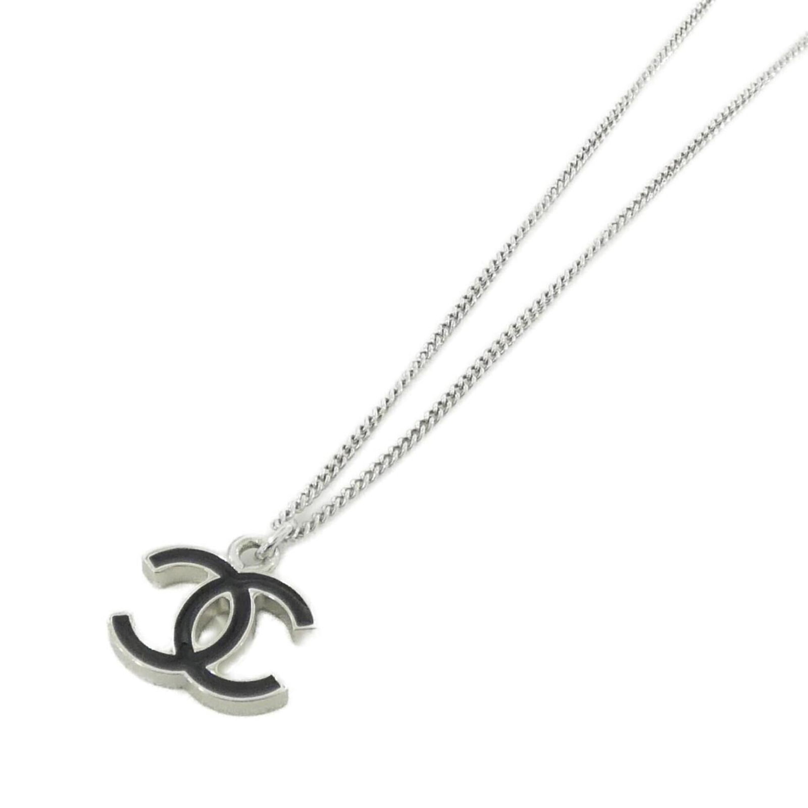 Chanel 26877 Necklace: Chanel 26877 Necklace Chanel's iconic 26877 Necklace boasts sleek, modern design with a striking black and silver finish. The necklace features a 20mm x 19mm pendant, carefully crafted to complement