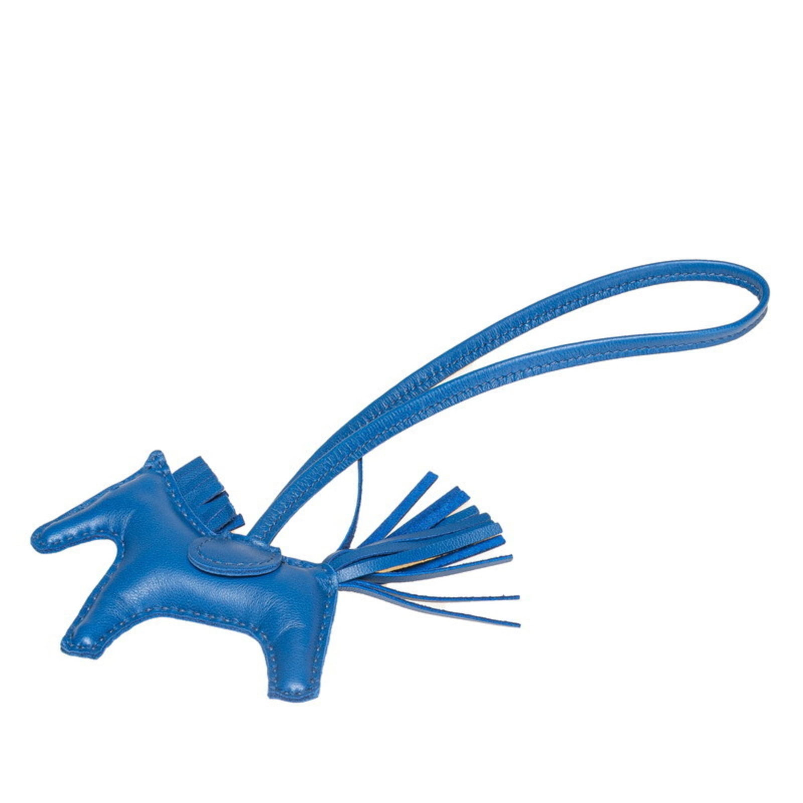 Agneau Handbag Charm Hermes: Agneau Handbag Charm Hermes Agneau Handbag Charm by Hermes features a striking blue color and measures 225.00mm x 135.00mm, making it a notable addition to any handbag collection. The charm comes in