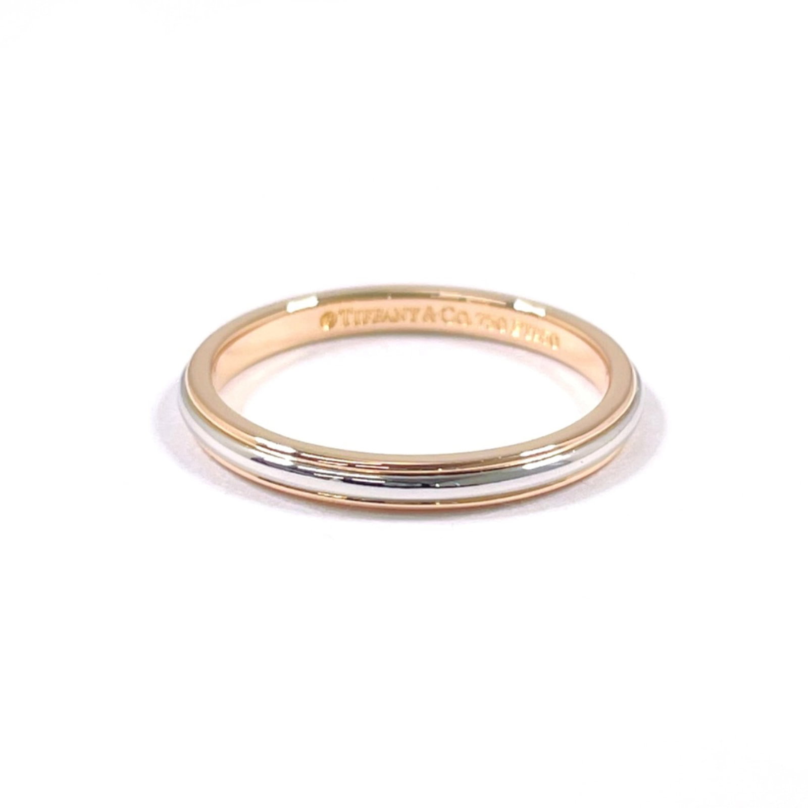 Pink Gold 950 Tiffany Ring Band Platinum: Pink Gold 950 Tiffany Ring Band Platinum Pink gold (18K) and platinum 950 US, this Tiffany ring band offers a luxurious combination of materials. The pink gold provides a warm, elegant touch, while