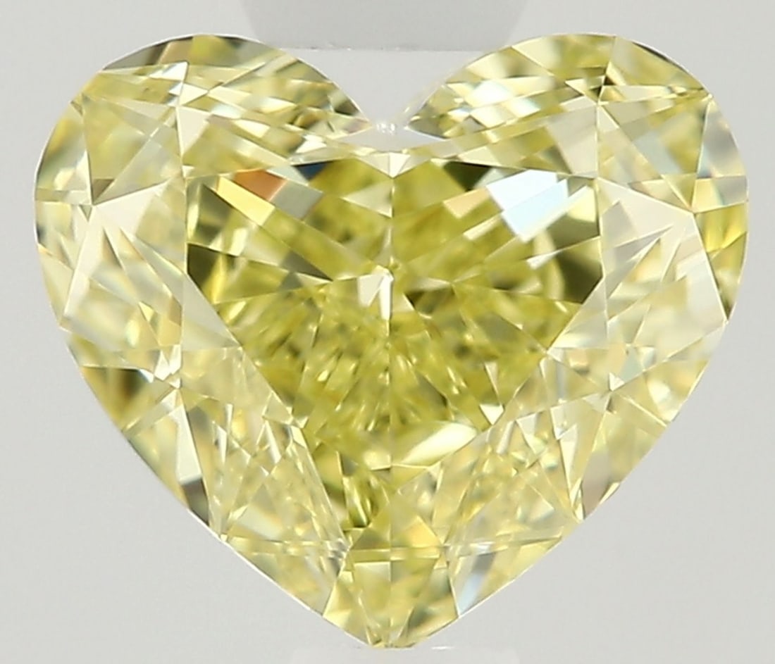 GIA Heart 0.62ct Fancy Yellow VVS1 - Loose Natural Diamond: GIA Heart 0.62ct Fancy Yellow VVS1 - Loose Natural Diamond GIA certifies this 0.62ct Fancy Yellow VVS1 diamond, showcasing its exceptional color and clarity. The stone's EX polish and VG symmetry