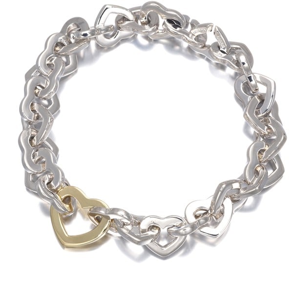 Tiffany and Co Silver 18k YG Heartlink Chain Bracelet: Tiffany and Co Silver 18k YG Heartlink Chain Bracelet Tiffany & Co.'s sterling silver 18k yellow gold Heartlink Chain Bracelet boasts a sleek, chain-style design with a subtle width and inner circumfe