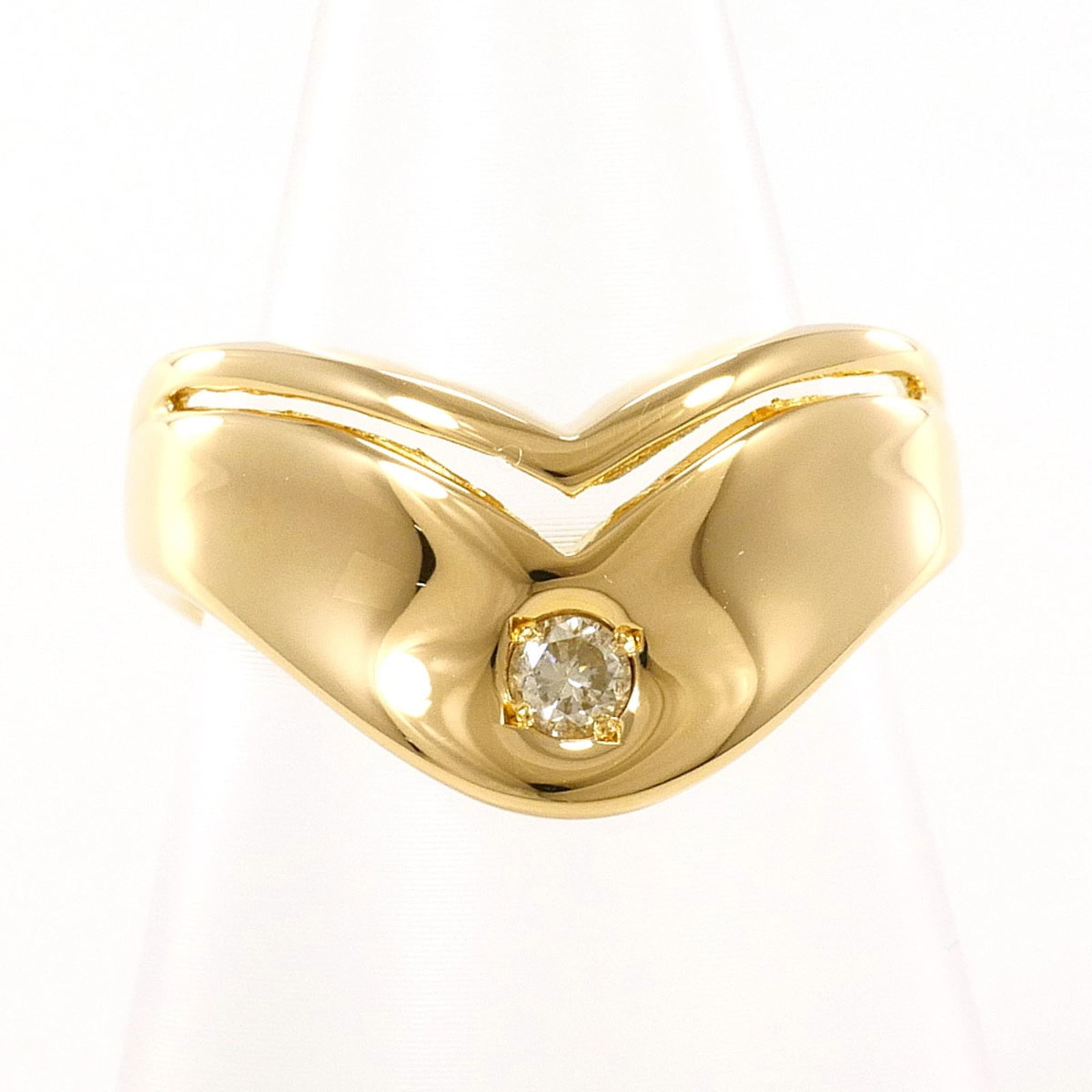 Yellow gold band ring unbranded: Yellow gold band ring unbranded Yellow gold band ring with a 0.09 carat diamond, set in an 18K yellow gold band, weighing 5.4g and measuring 10mm wide. This unbranded women's band features a classic d