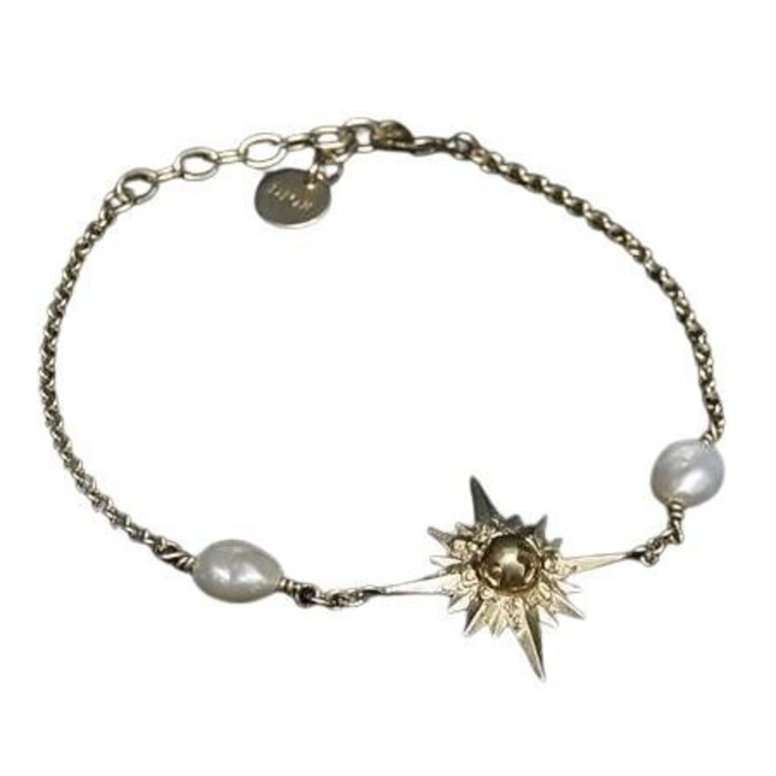 Christian Dior Charm Bracelet Metal: Christian Dior Charm Bracelet Metal Gold Charm Bracelet from Christian Dior, measuring 21.8cm in length. This metal charm bracelet features the iconic brand's signature style, making it a stylish acce