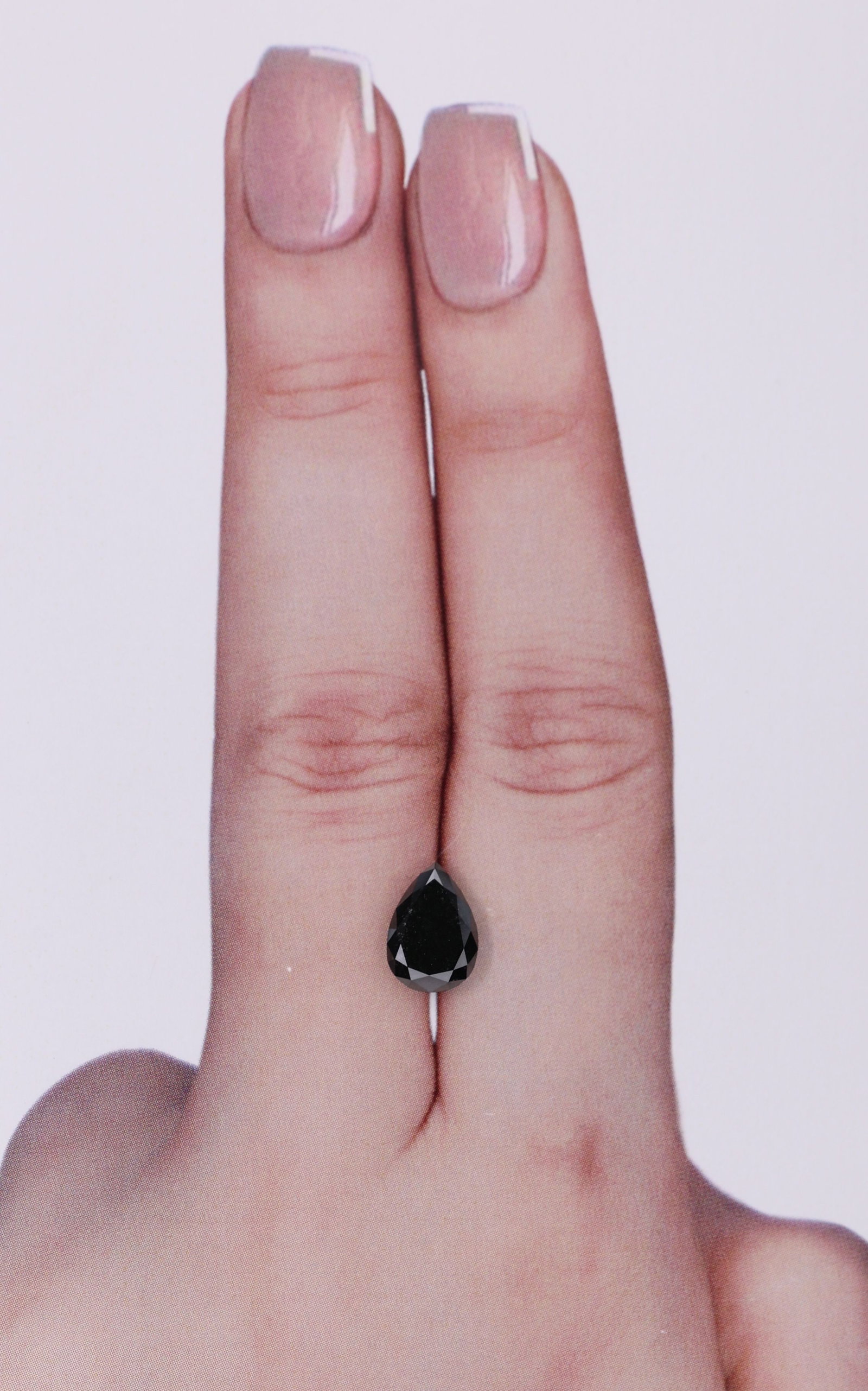 GIA Pear 1.36ct Fancy Black VVS2 - Loose Natural Diamond: GIA Pear 1.36ct Fancy Black VVS2 - Loose Natural Diamond GIA-certified Fancy Black diamond with exceptional clarity and polish. This loose natural stone boasts a vibrant black color and impressive sym