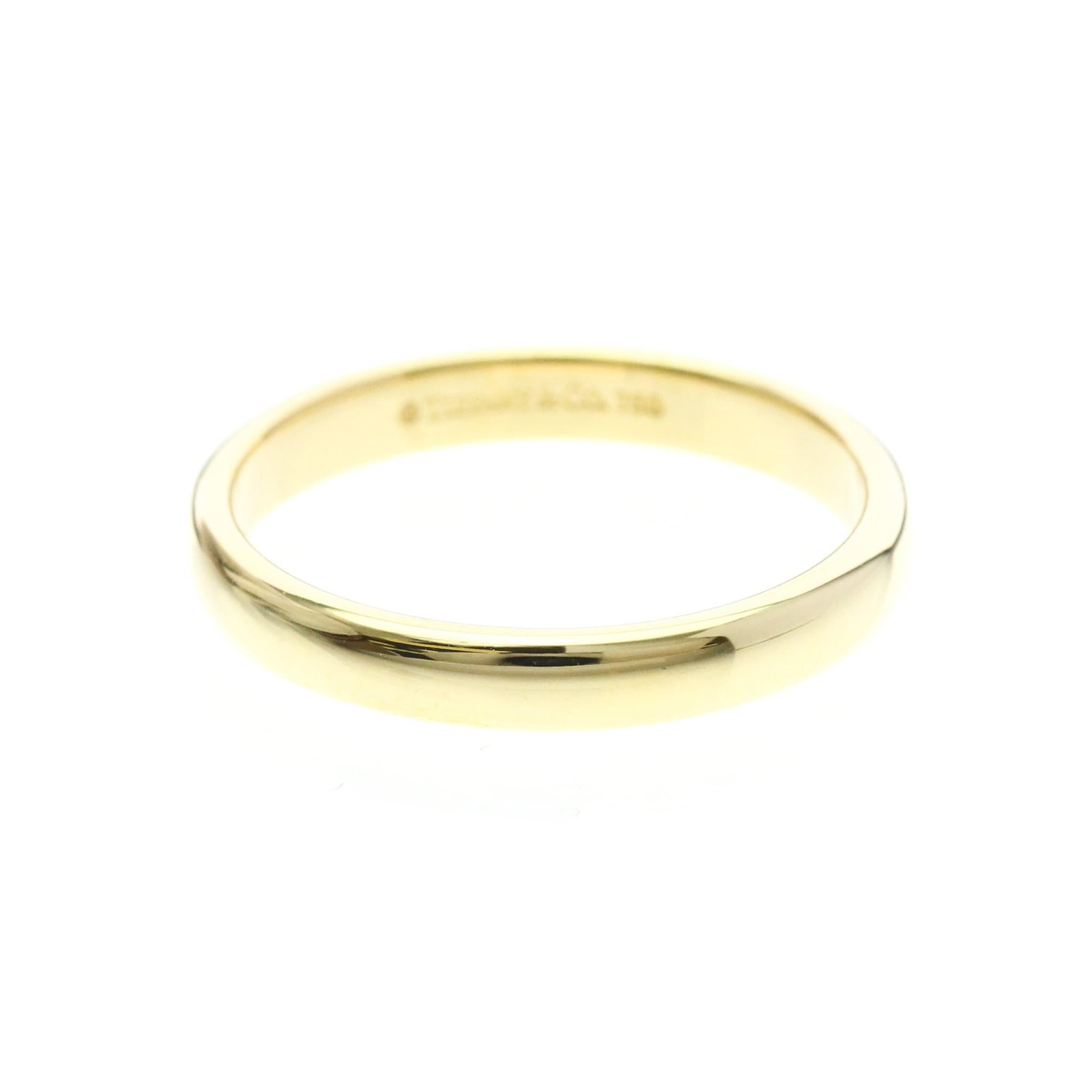 Tiffany ring gold 18k yellow band: Tiffany ring gold 18k yellow band 18k yellow gold band with a sleek, sophisticated design. This Tiffany ring features a sturdy 3mm width and weighs 3.7g, making it a comfortable choice for everyday we
