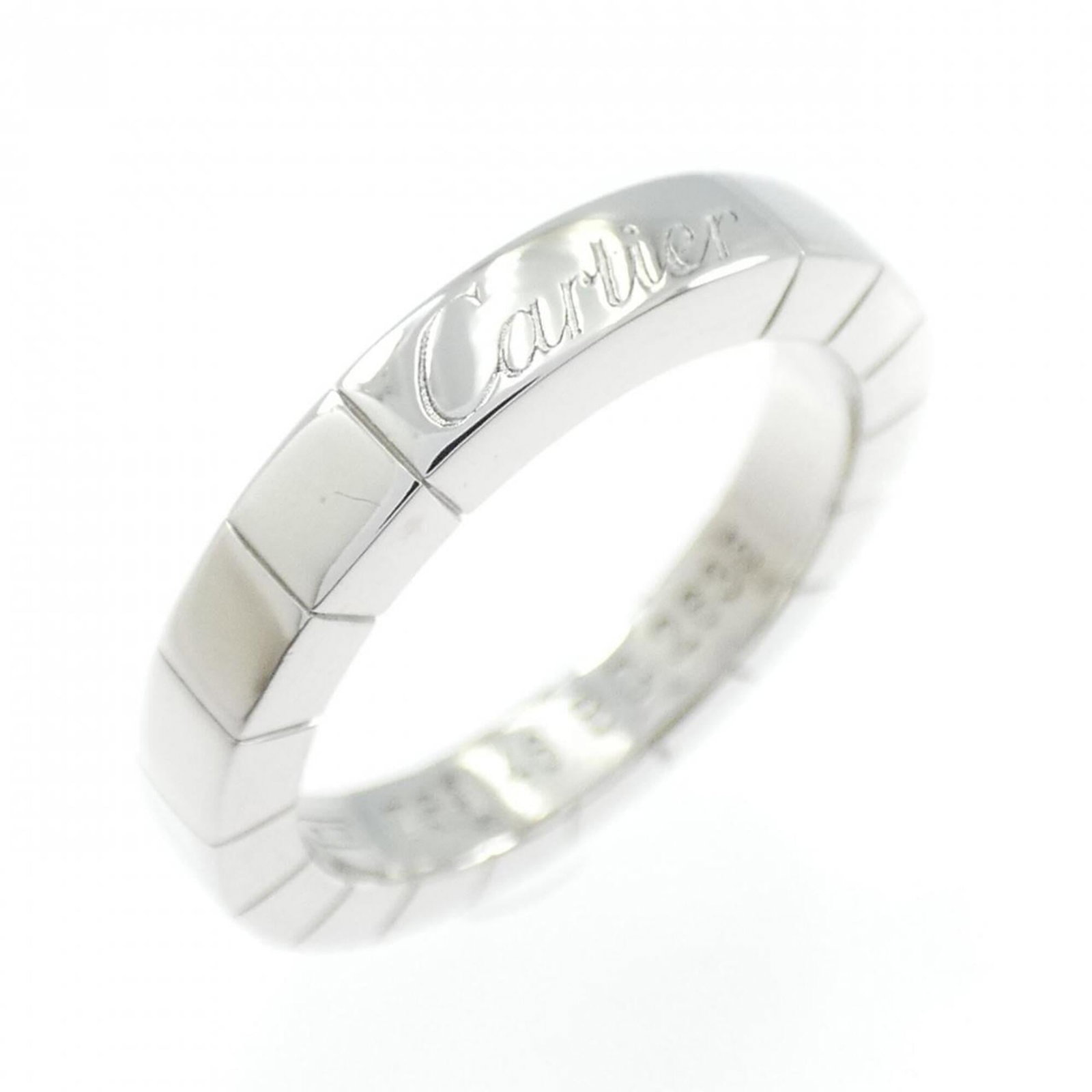 White Gold Band Ring by Cartier 18K: White Gold Band Ring by Cartier 18K Cartier's 18K white gold band ring boasts elegant simplicity, featuring a classic design that exudes timeless sophistication. This high-quality piece is crafted fro