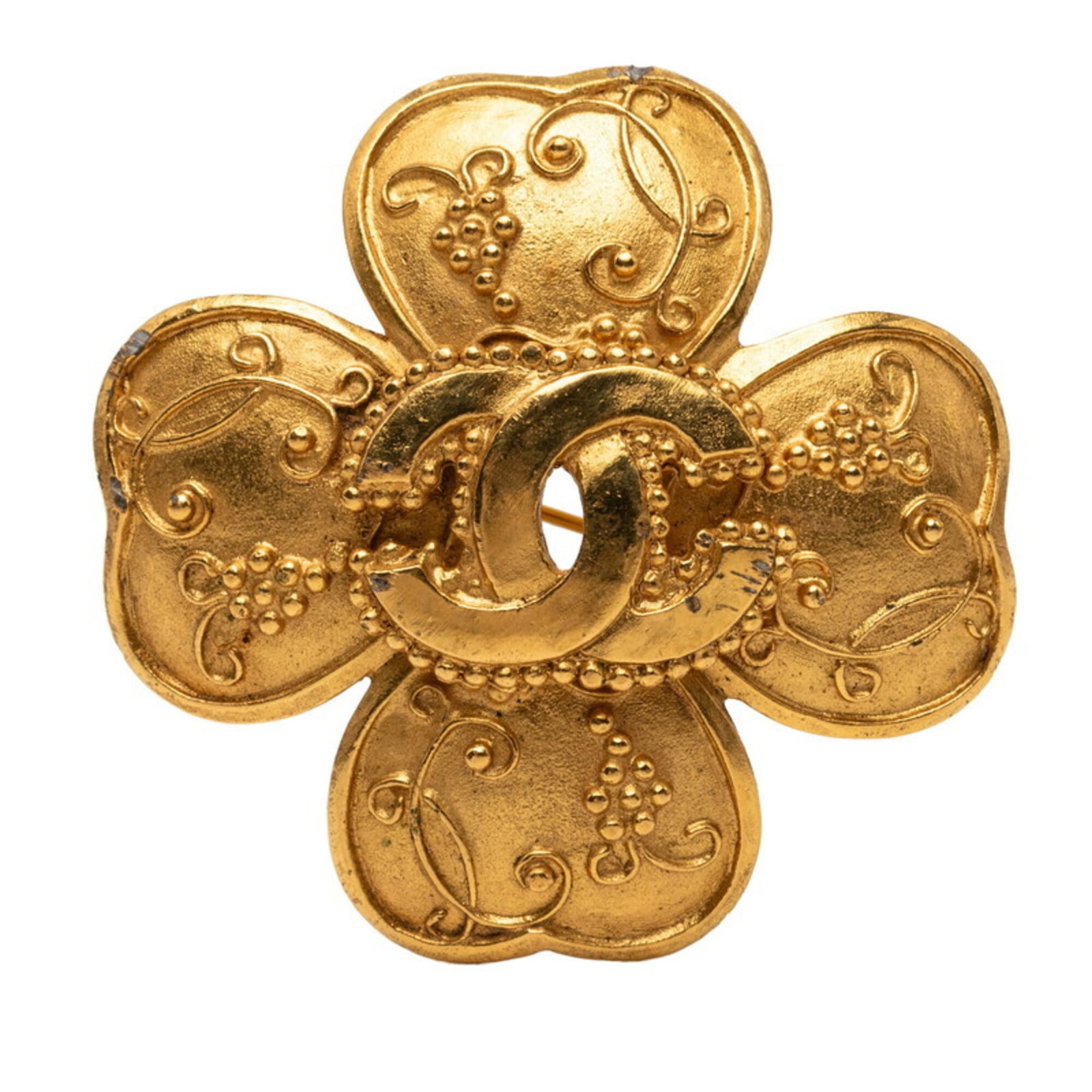 Chanel Brooch: Chanel Brooch Gold Chanel Brooch measures 4.65cm x 4.65cm / 1.83'' x 1.83''. The brooch bears a signature and features the iconic Chanel brand. Made from gold, it is a small yet elegant accessory. Ite