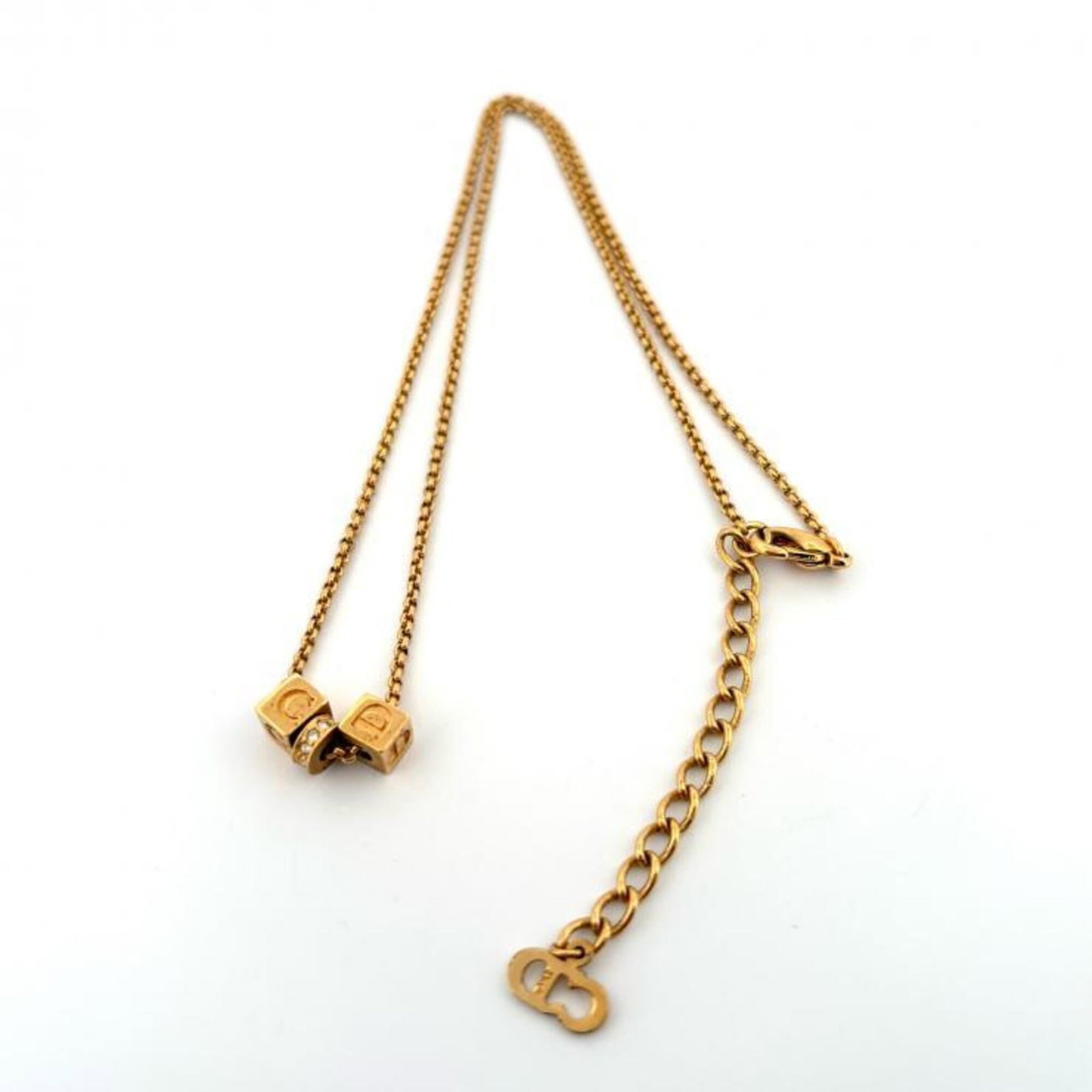 Christian Dior Necklace Cube Logo Cd Design Rhinestones Gold Plated.: Christian Dior Necklace Cube Logo Cd Design Rhinestones Gold Plated. Gold plated and adorned with rhinestones, the Christian Dior Necklace Cube Logo Cd Design boasts a striking gold finish. The 42 cm 