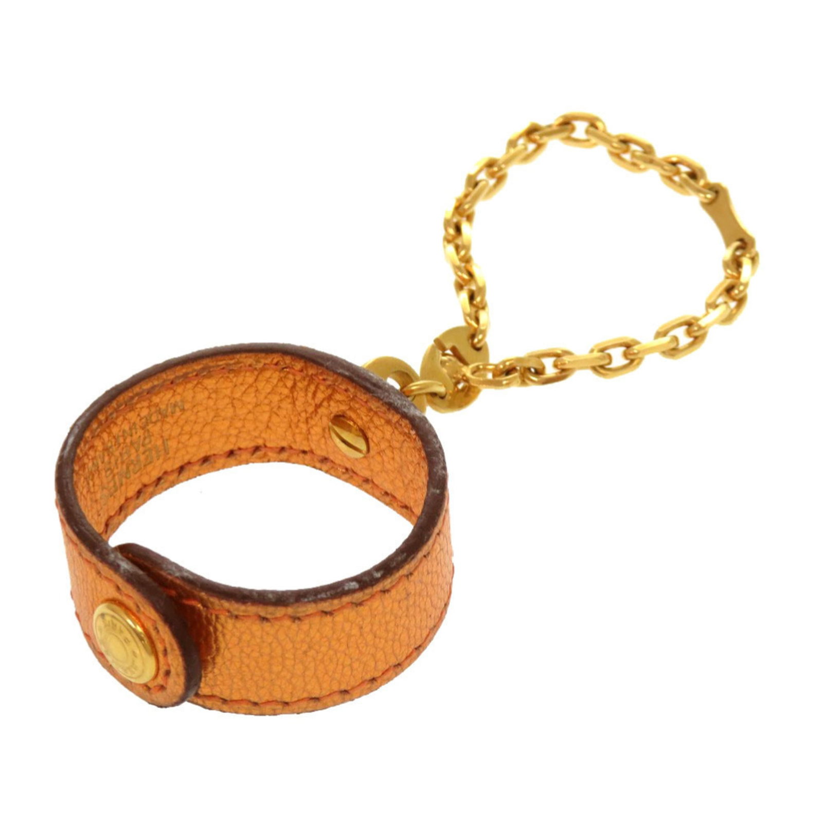 Hermes Leather Metal Charm Handbag: Hermes Leather Metal Charm Handbag Vachetta leather and metal charm, crafted in France by Hermes. This small, vibrant orange handbag charm measures just 3.50mm x 4.50mm x 1.50mm. Comes with a box for 