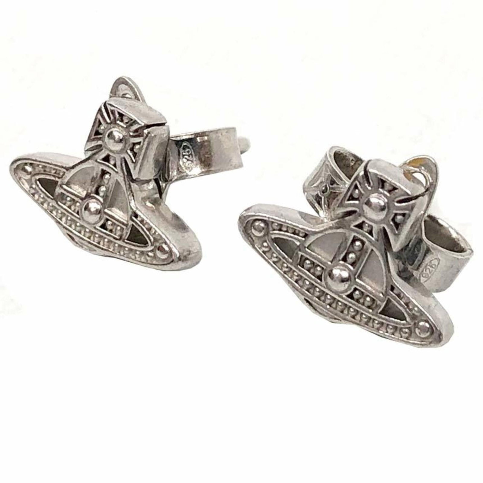Silver Stud 925 earrings by Vivienne Westwood: Silver Stud 925 earrings by Vivienne Westwood Silver Stud 925 earrings by Vivienne Westwood. Made from high-quality silver, these stud earrings showcase the iconic design of Vivienne Westwood's fashio