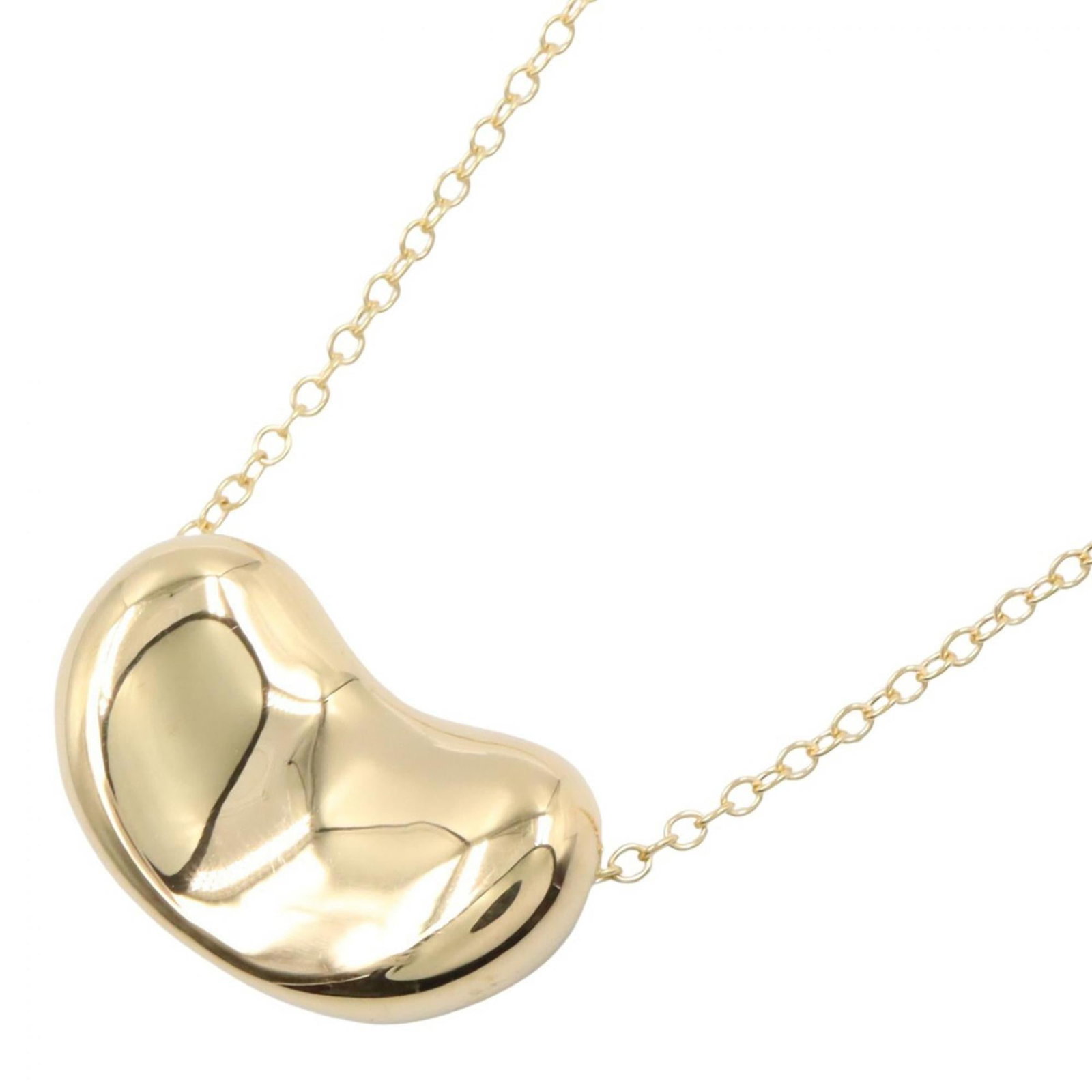 Women's Tiffany Co. Gold Bean Necklace Yellow 18K: Women's Tiffany Co. Gold Bean Necklace Yellow 18K Yellow gold (18K) Tiffany Co. necklace with a 16mm x 25mm pendant, available in a 76 cm / 29.92'' circumference. This 18K yellow gold piece features a