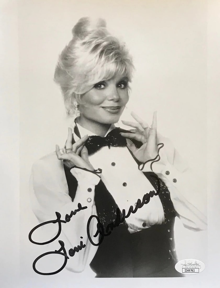 Anderson Autographed Lonnie Photo JSA 8x10: Anderson Autographed Lonnie Photo JSA 8x10 Authentic Lonnie Anderson photo, signed across the front in black sharpie by the artist. The James Spence Authentication (JSA) verifies the signature, provid